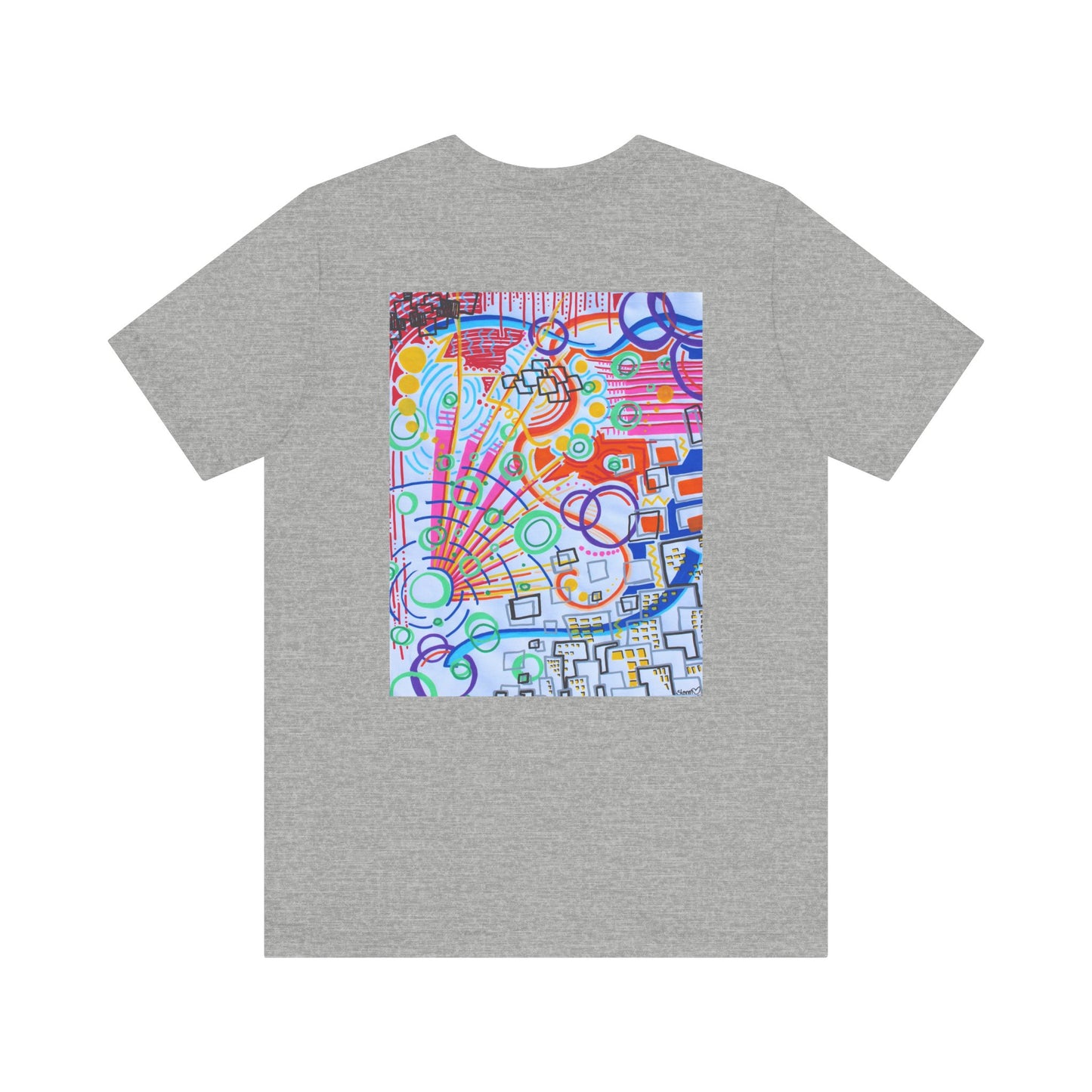 This is the Atheltic Heather The City Jersey T-Shirt by Storm Garden Studio. This showcases the back of the shirt. The image is from the upper back to the mid waist. The illustration is rectangular shaped and has a multitude of colors like blue, red, pink, yellow, green and light blue. It is an abstract image with building shapes, circles and squiggles. This is against a white background.