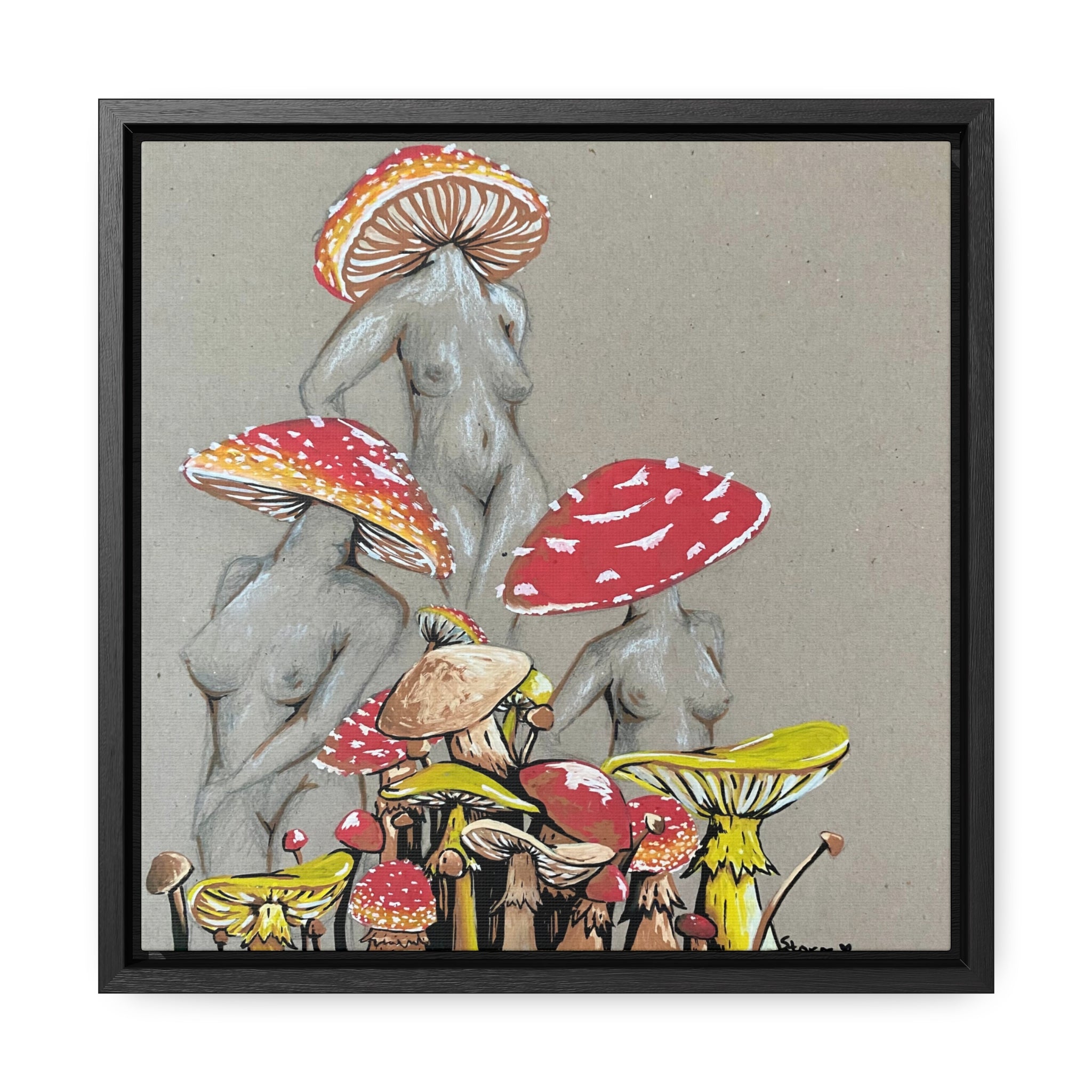 This is the 12" x 12" Miss Amanita Gallery Canvas Wrap with Black Square Frame by Storm Garden Studio. The depth of the frame is 1.25". The image shows the canvas flat on a white wall. This is an illustration of three mushroom headed nude women. The foreground has assorted mushrooms in different sizes. The women are positioned in a triangle shape. The colors range from yellow, orange and red. Each of the bodies are shaded in white, black or grey and match the background of the illustration.