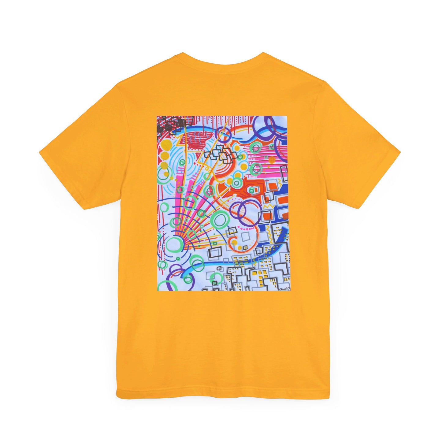 This is the Gold The City Jersey T-Shirt by Storm Garden Studio. This showcases the back of the shirt. The image is from the upper back to the mid waist. The illustration is rectangular shaped and has a multitude of colors like blue, red, pink, yellow, green and light blue. It is an abstract image with building shapes, circles and squiggles. This is against a white background.