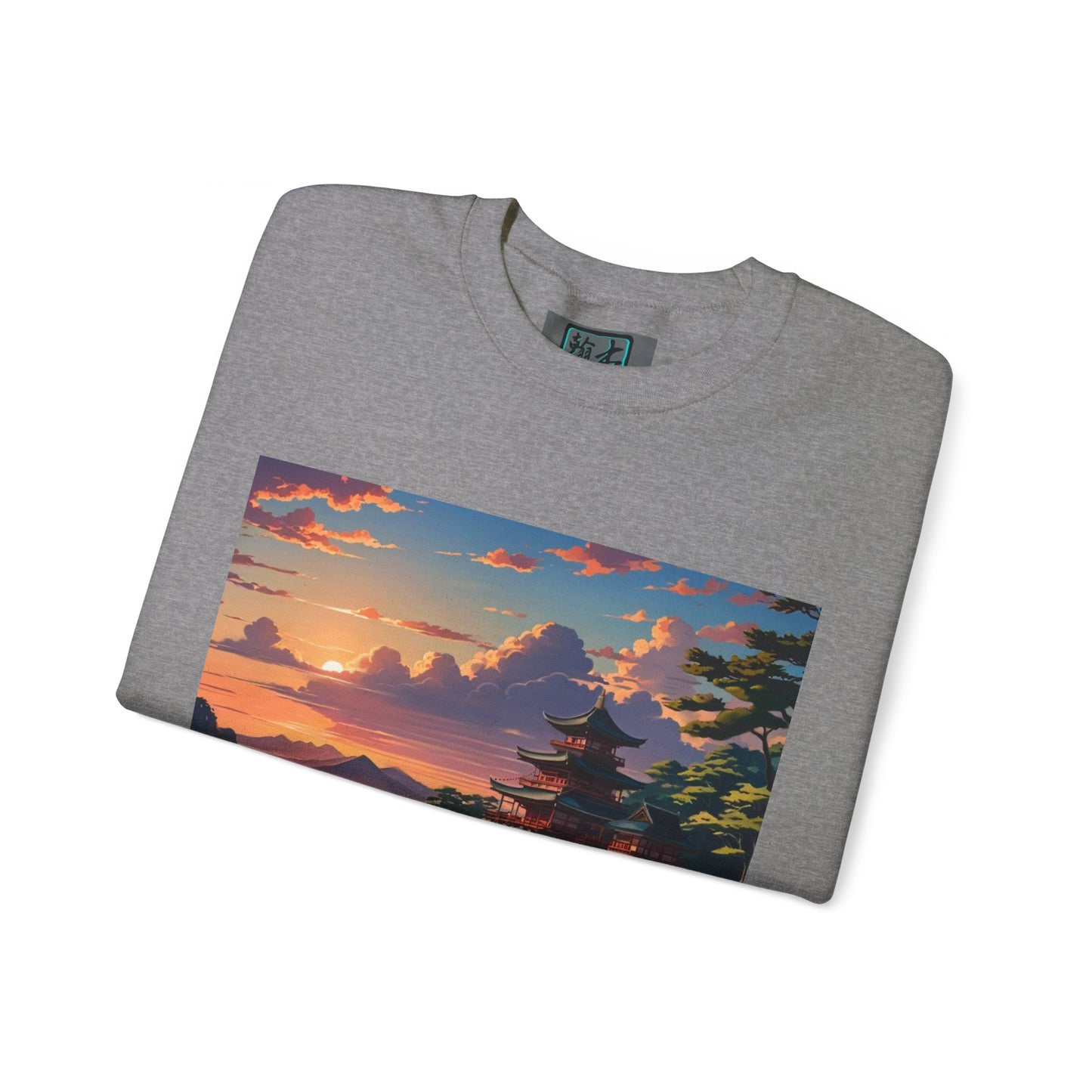 This is the Graphite Heather Temple of Peace Sweatshirt by Lee Hansheng Studios. It comes in sizes S-5XL. This is the front of the shirt folded. The logo is on the inside of the shirt. The top part of the illustration shows a setting red/orange sun above clouds, one blue roof,brown/red walled temples, mountains that are faraway and some trees to the right. It is against a white background.