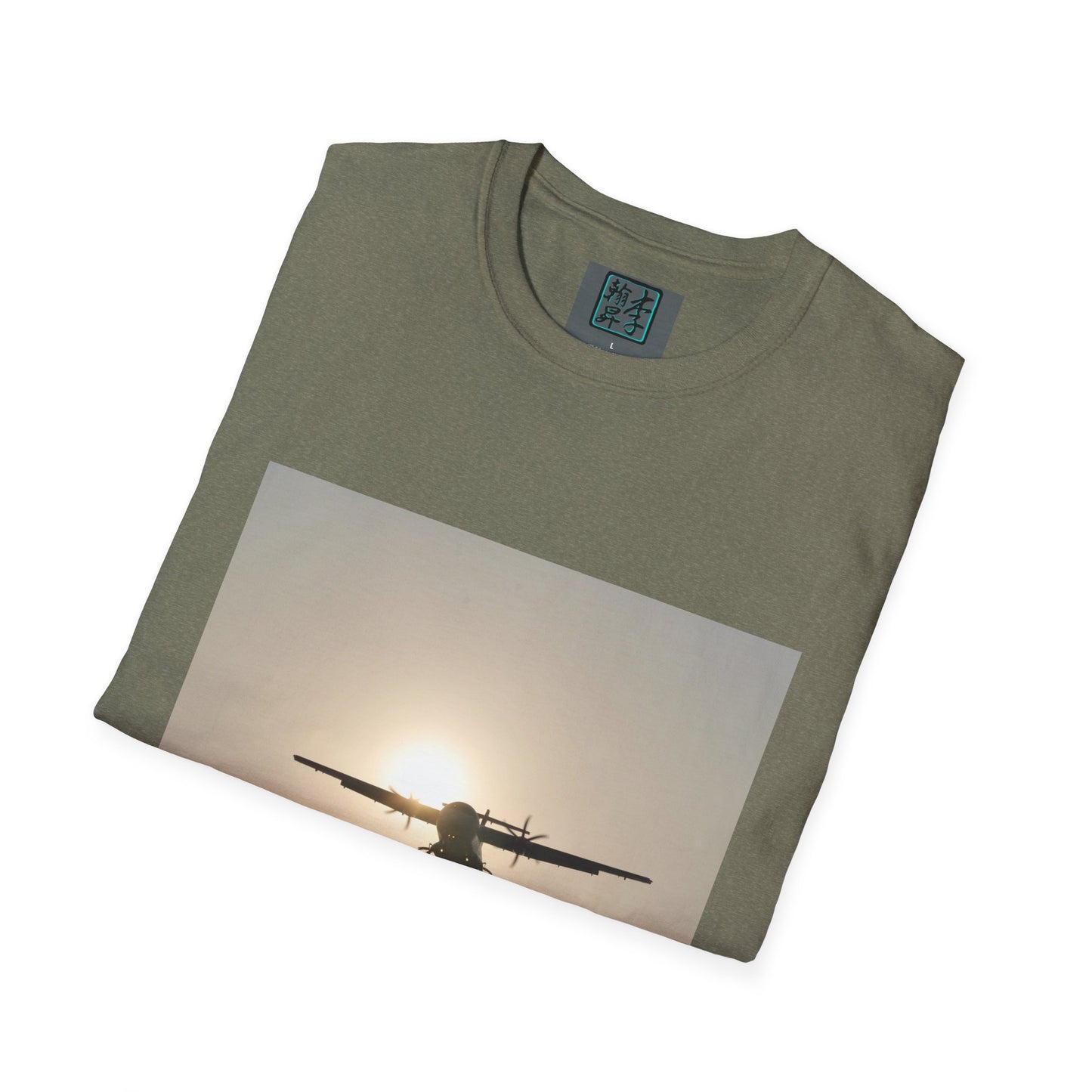 This is the Heather Military Green Landing T-Shirt by Lee Hansheng Studios. This is an image of the front folded. On the inside of the shirt is the logo for the studio printed in black outlined in blue, gray size label with the print being white. The illustration is a rectangular design of an airplane landing. There is an orange/yellow sun with the shadowed plane. The shirt is against a white background.