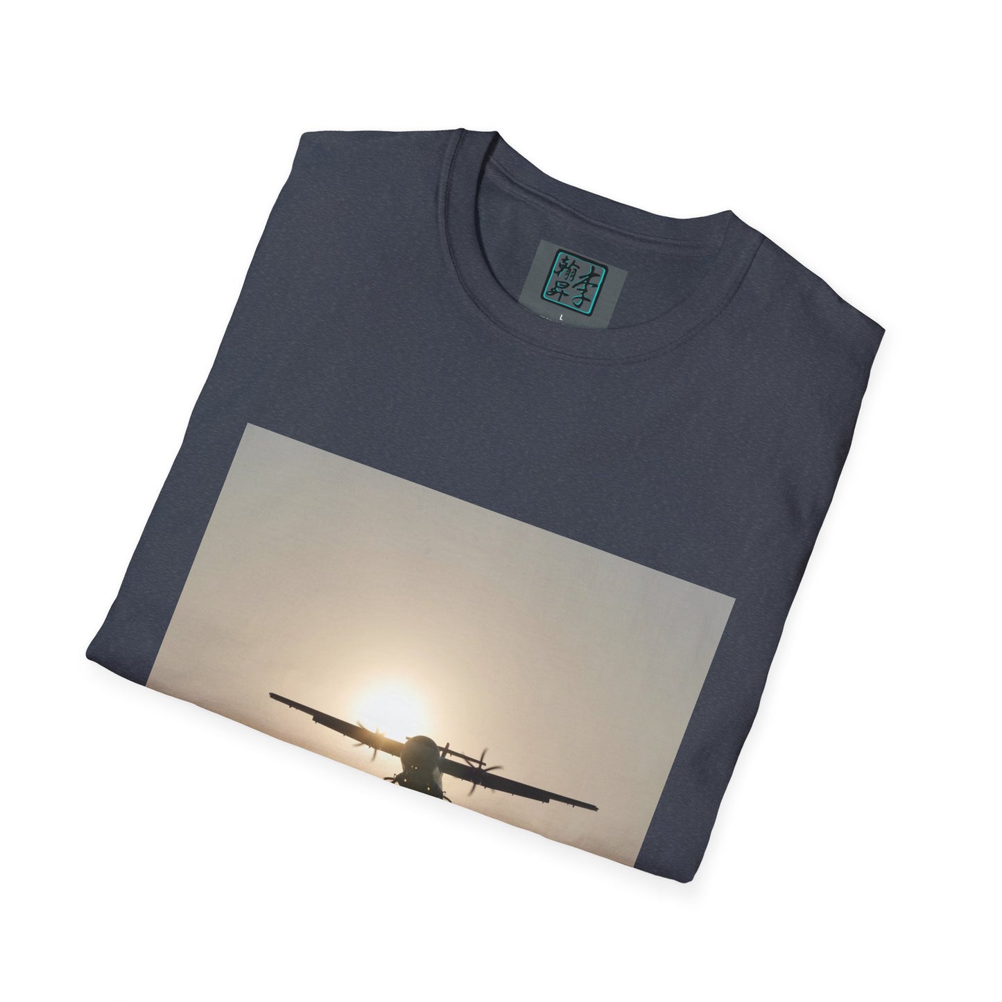 This is the Heather Navy Landing T-Shirt by Lee Hansheng Studios. This is an image of the front folded. On the inside of the shirt is the logo for the studio printed in black outlined in blue, gray size label with the print being white. The illustration is a rectangular design of an airplane landing. There is an orange/yellow sun with the shadowed plane. The shirt is against a white background.
