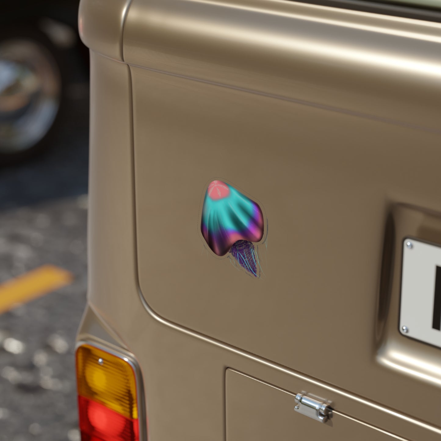 A 4" x 4" die cut transparent sticker with a pink, blue and purple jellyfish on the bumper of a car.