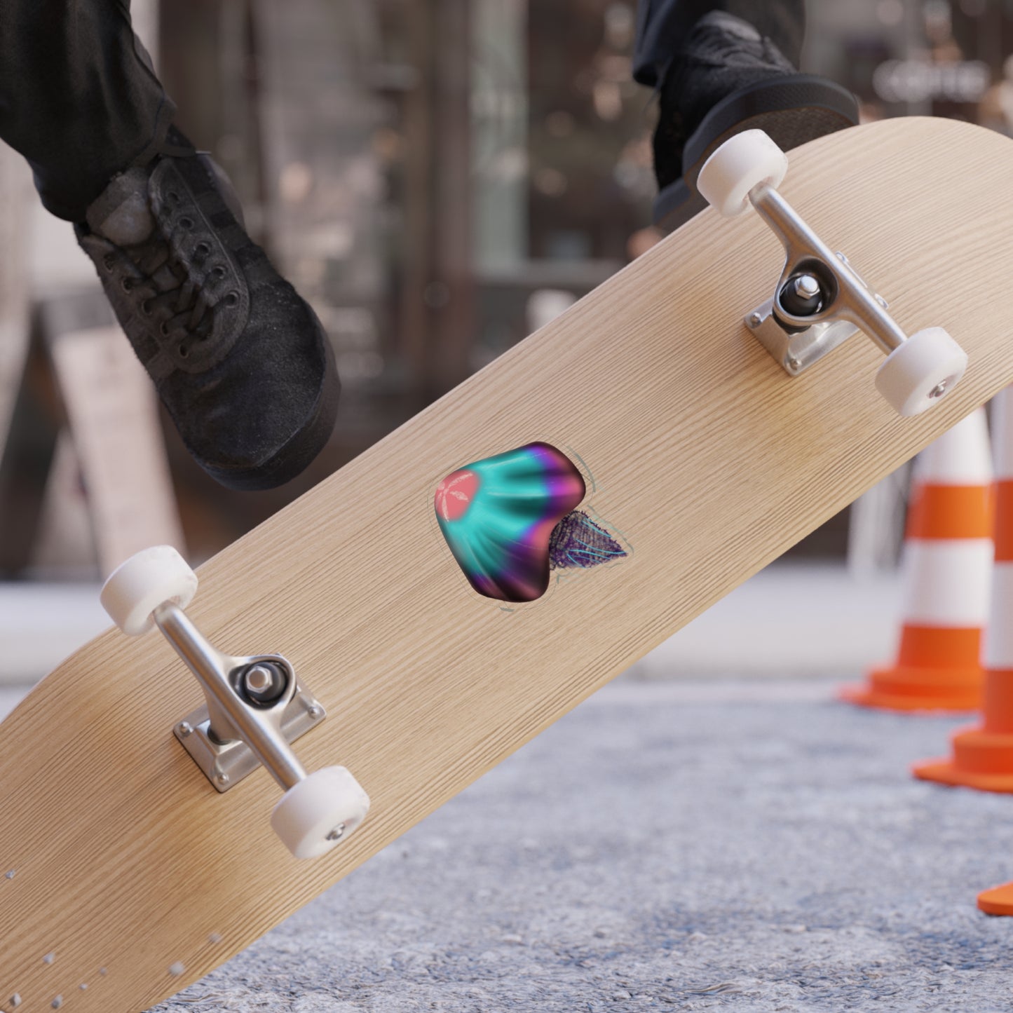 A 4" x 4" pink, blue, purple jellyfish on a skateboard. IT is a die-cut transparent sticker.