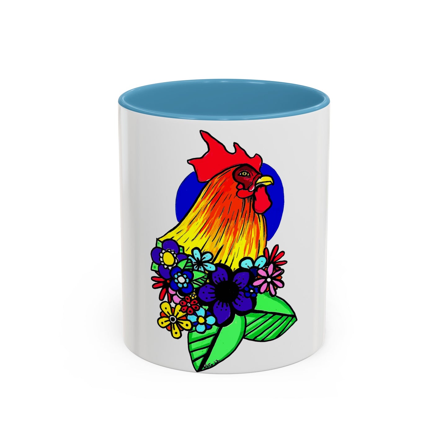 This it the Light Blue 11 oz Cock Accent Coffee Mug by Storm Garden Studio. This image showcases the front of the mug. The illustration is of a rooster with a dark blue circular background. The rooster is adorned with flowers on the bottom of its neck. It is bright green, dark blue, yellow, orange and pink. The rooster is bright red and fades into yellow. The mug is against a white background.