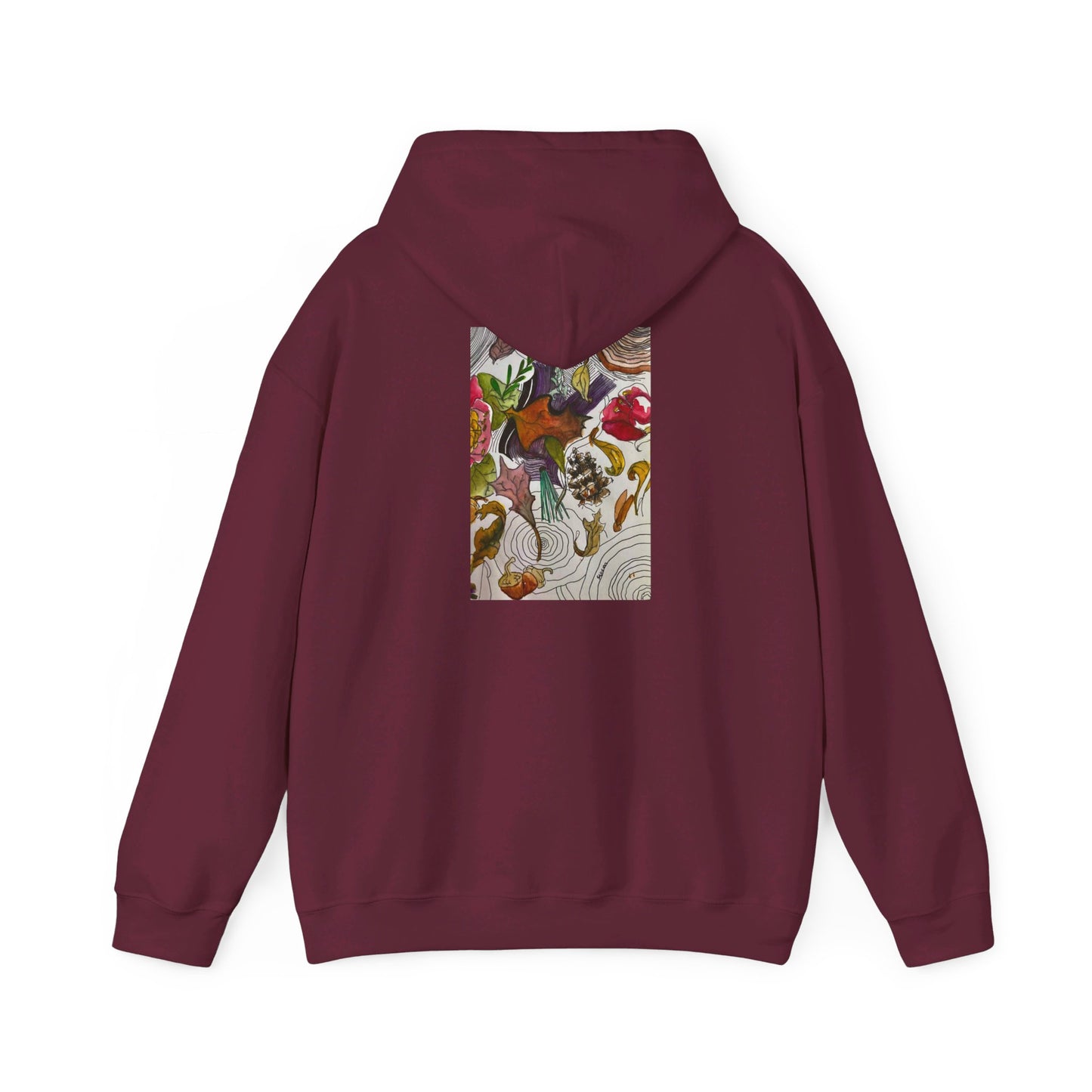 This is the Maroon Fall is falling Heavy Blend Hooded Sweatshirt by Storm Garden Studio. It comes in sizes S-5XL. The image is from the back with the hood down. The drawstring is color matched. The illustration is within a rectangle starting from the upper back to mid back. There are various conifers like leaves,pine cones,etc. There are also some flowers and a tree trunk ring.The colors are red, yellow, dark brown, purples, and green. It is against from a white background.