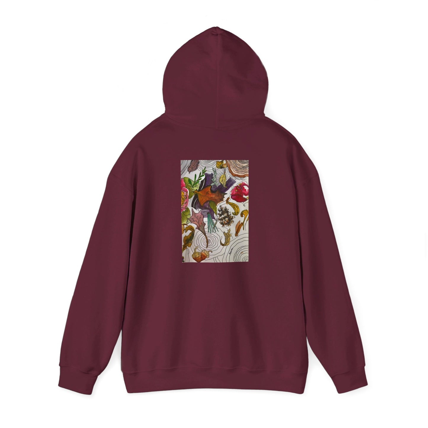 This is the Maroon Fall is falling Heavy Blend Hooded Sweatshirt by Storm Garden Studio. It comes in sizes S-5XL. The image is from the back with the hood up to show the shoulder area. The drawstring is color matched. The illustration is within a rectangle starting from the upper back to mid back. There are various conifers like leaves,pine cones,etc. There are also some flowers and a tree trunk ring.The colors are red, yellow, dark brown, purples, and green. It is against from a white background.