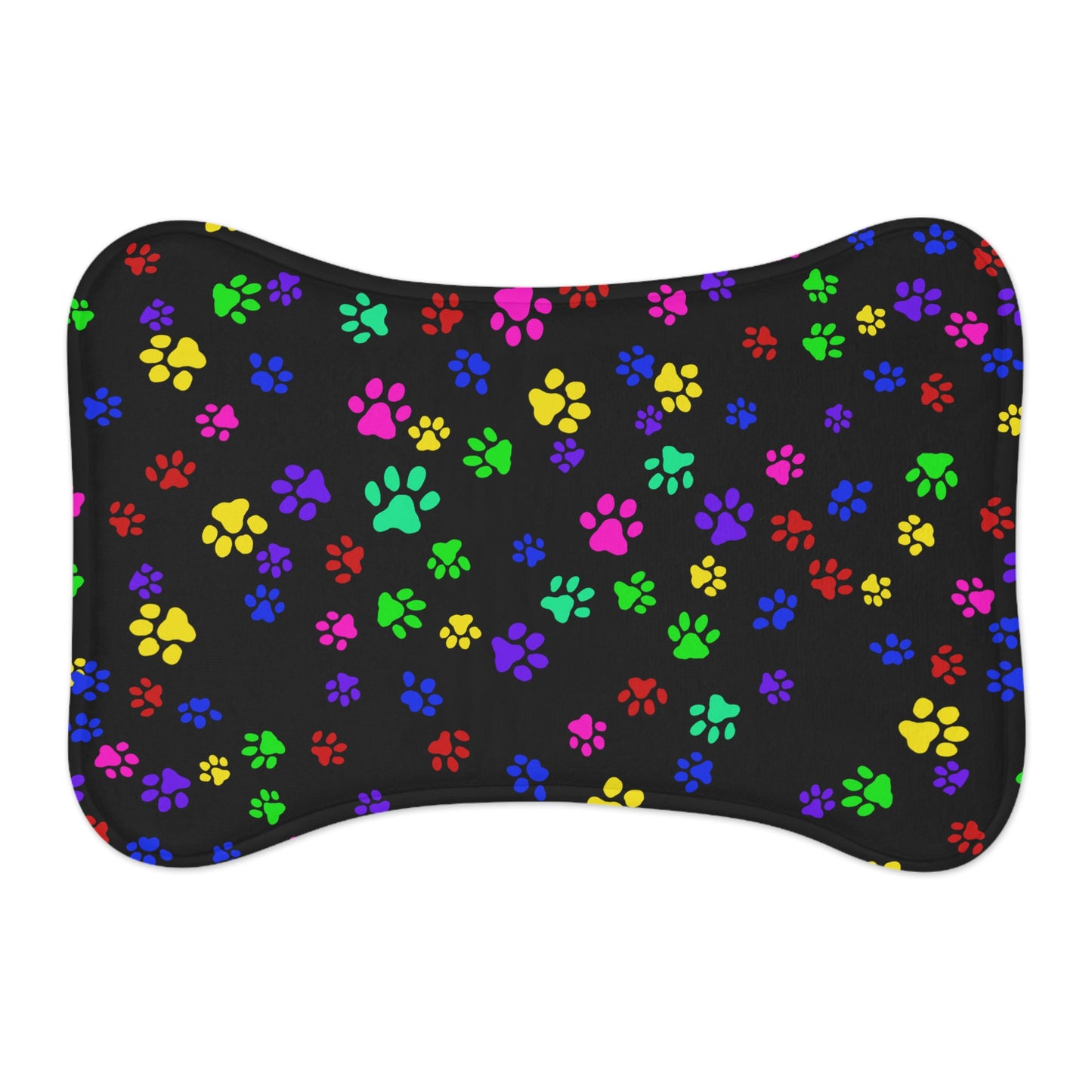 This is the 19" x 14" Bone Shape Paws on Paws Pet Feeding Mat. This shows the bone shape with different sized color paws on the design. The colors are yellow, green red, blue and purple on a black background. This is the front view of the feeding mat against a white background.