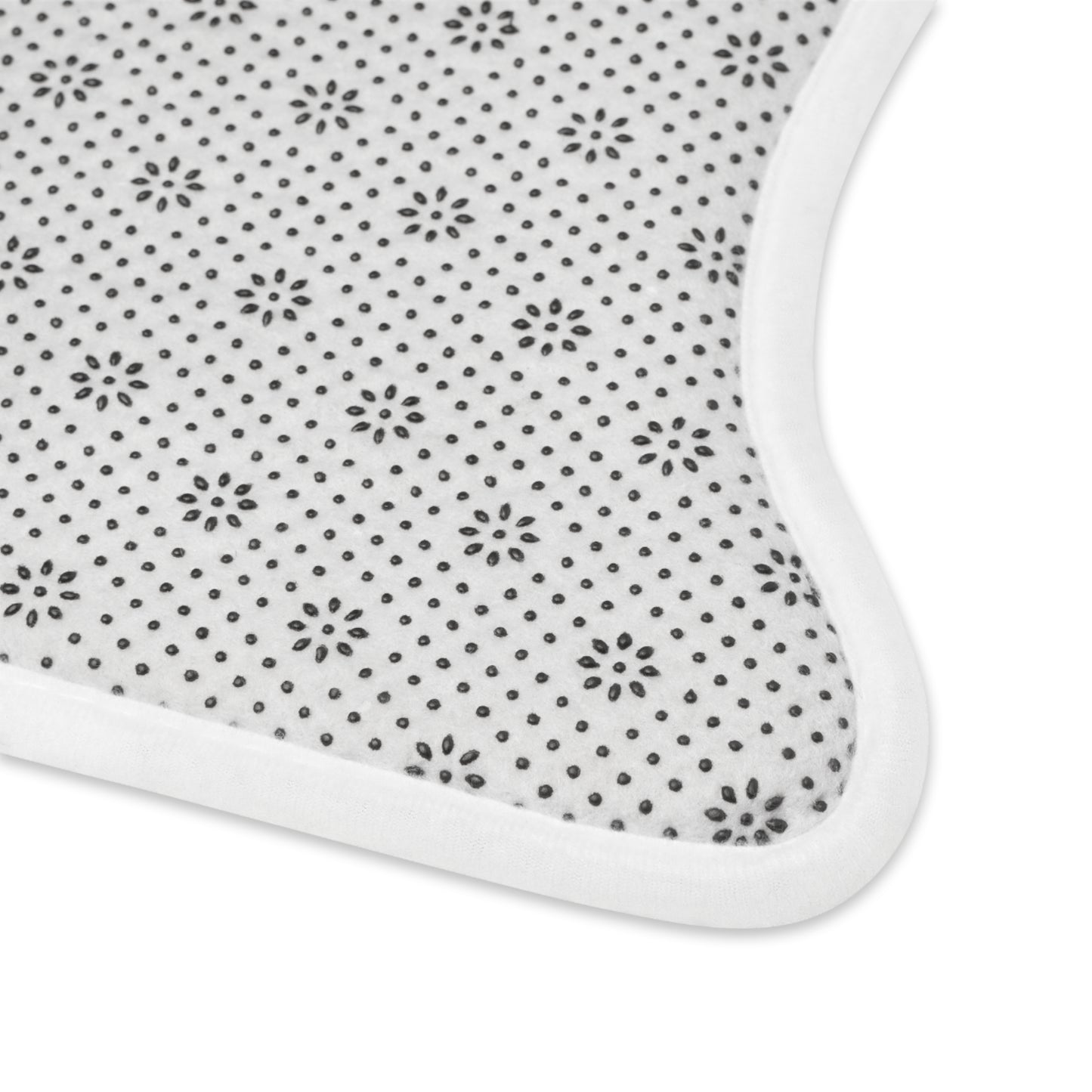 This is the 30" x 18" Bone Shape Paws on Paws Pet Feeding Mat. This is the back side of the deegin mat that shows the non-slip bottom design. The back is white and foam material is black.