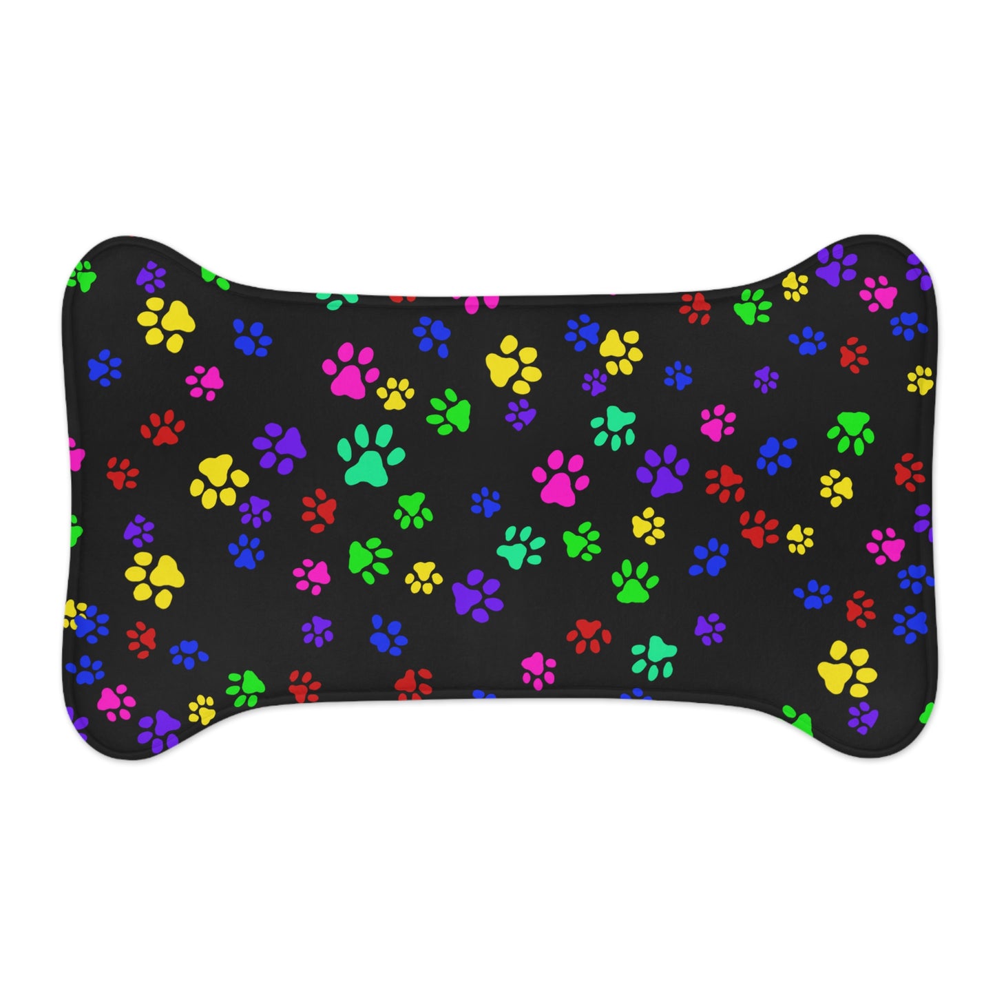 This is the 30" x 18" Bone Shape Paws on Paws Pet Feeding Mat. This shows the bone shape with different sized color paws on the design. The colors are yellow, green red, blue and purple on a black background. This is the front view of the feeding mat against a white background.