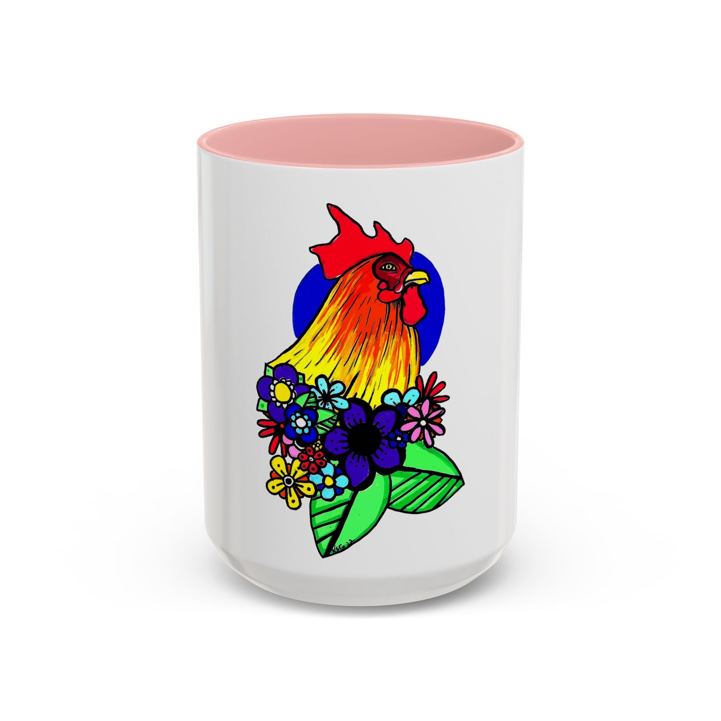 This it the Pink 15 oz Cock Accent Coffee Mug by Storm Garden Studio. This image showcases the front of the mug. The illustration is of a rooster with a dark blue circular background. The rooster is adorned with flowers on the bottom of its neck. It is bright green, dark blue, yellow, orange and pink. The rooster is bright red and fades into yellow. The mug is against a white background.