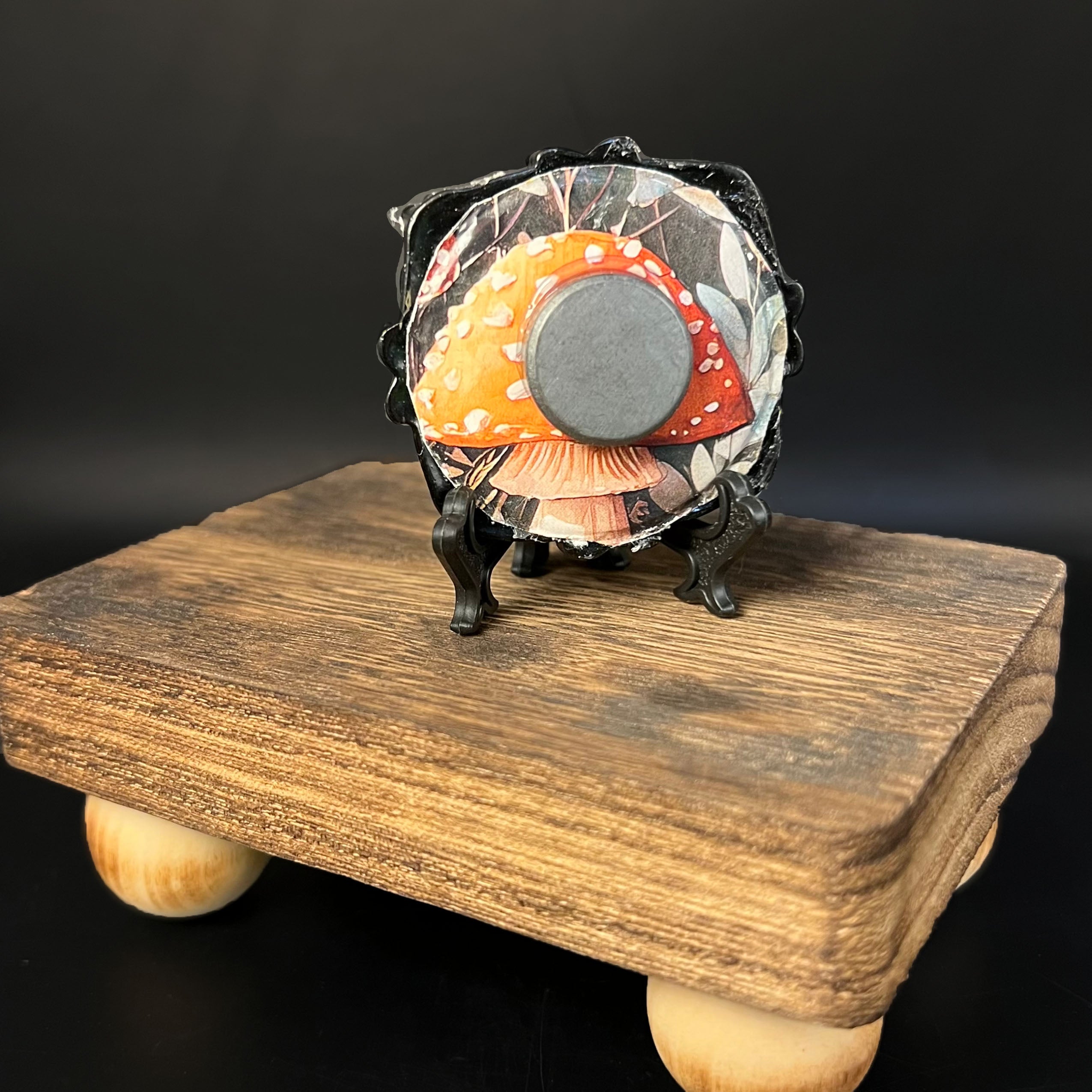 Close-up of the miniature's textured poison symbol and subtle brushwork highlighting the detailed, aged paint finish.