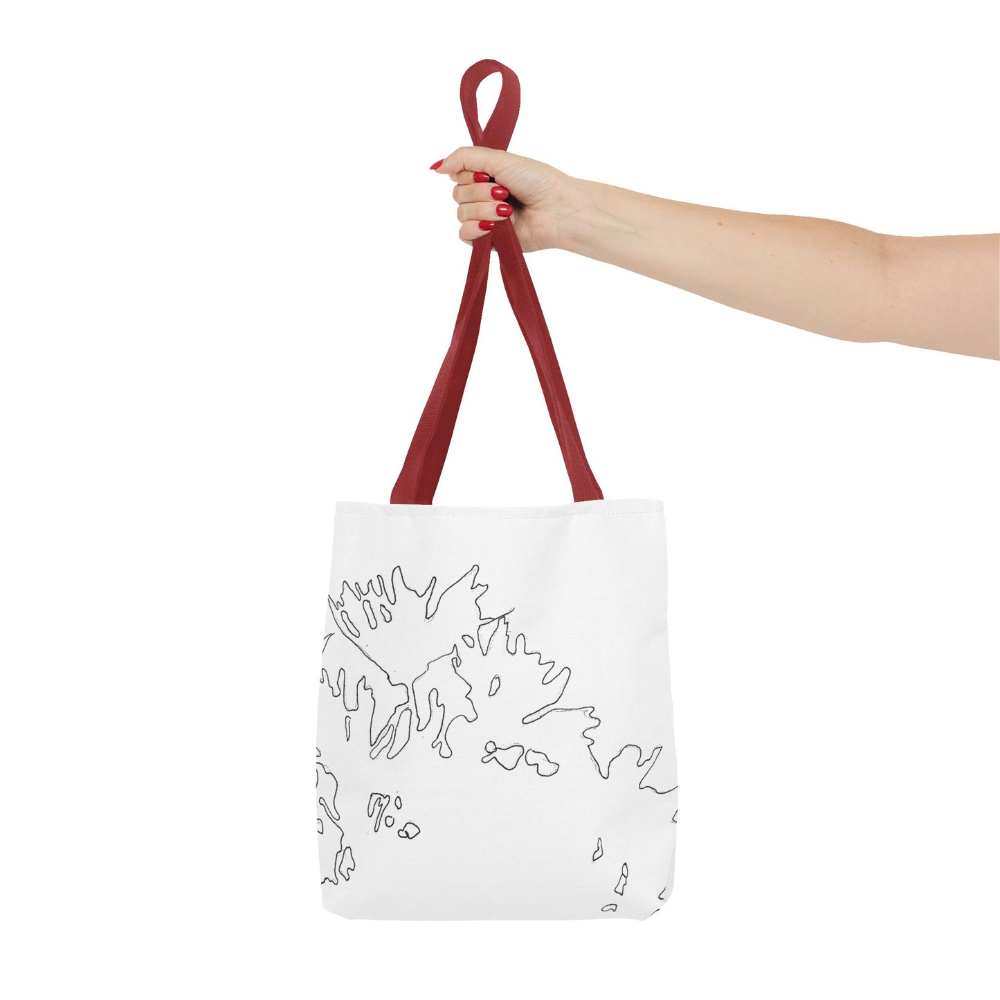 This is the Red 13" x 13" Flowers Tote Bag by Storm Garden Studio. The tote has color matched straps, abstract line work which is outlines of flowers, all over print. The colors are white and black. A lady's upper arm is to the left and a hand stretched out holding the handles of the tote in the middle. The tote is against a white background.