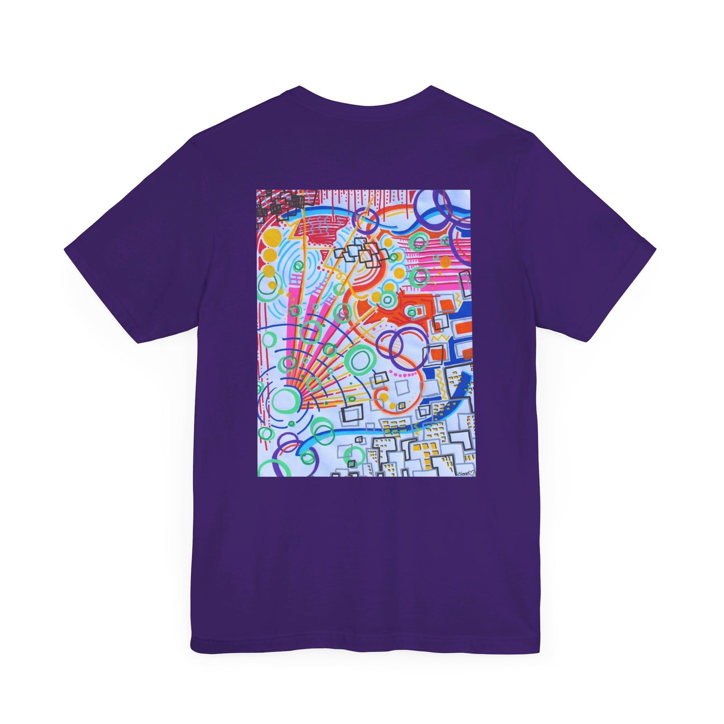 This is the Team Purple The City Jersey T-Shirt by Storm Garden Studio. This showcases the back of the shirt. The image is from the upper back to the mid waist. The illustration is rectangular shaped and has a multitude of colors like blue, red, pink, yellow, green and light blue. It is an abstract image with building shapes, circles and squiggles. This is against a white background.