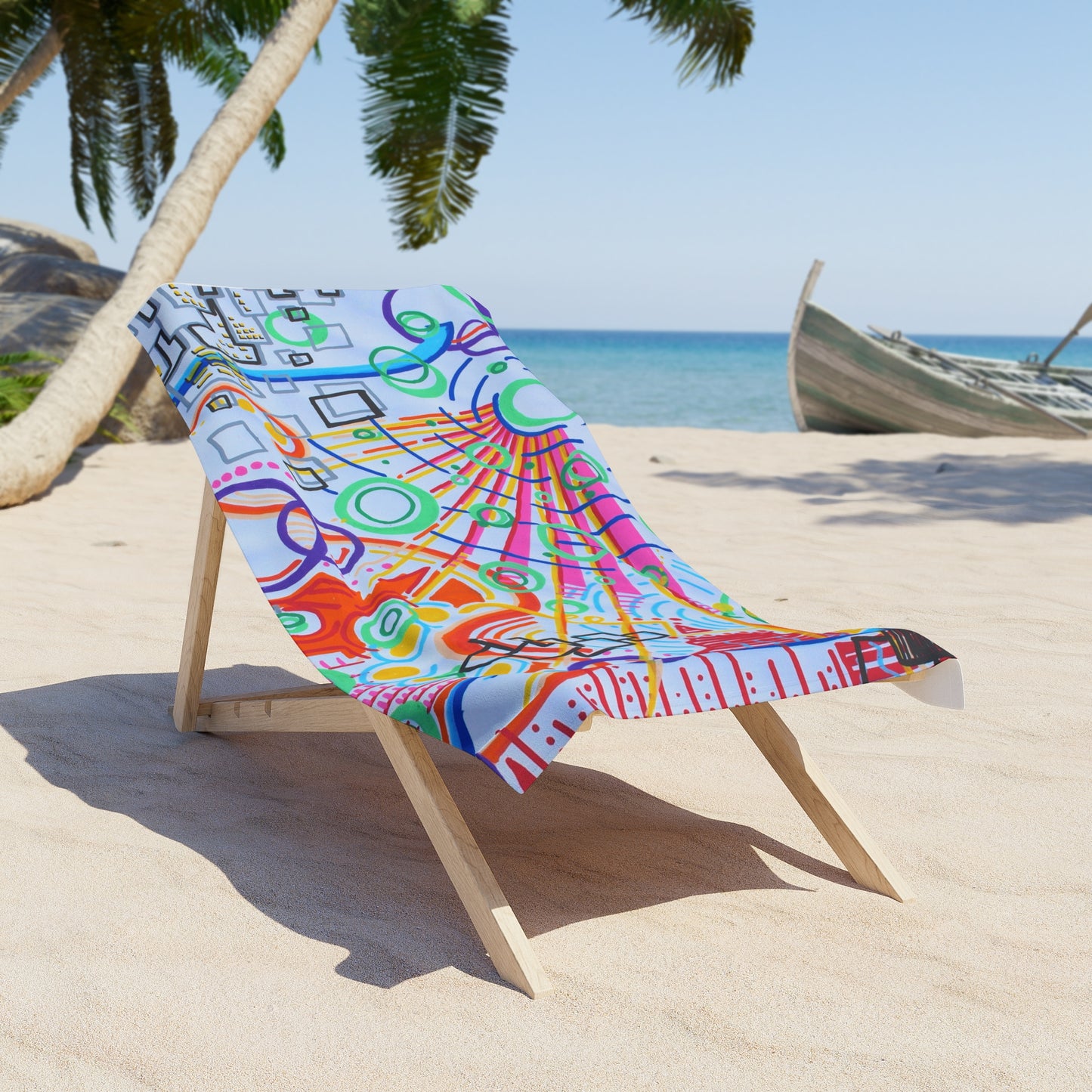 This is the 30" x 60" The City Beach Towel by Storm Garden Studio. The illustration is rectangular shaped and has a multitude of colors like blue, red, pink, yellow, green and light blue. It is an abstract image with building shapes, circles and squiggles. The towel is on a light wood beach chair with a beach background including sand, palm tree on the left and a boat to the right.
