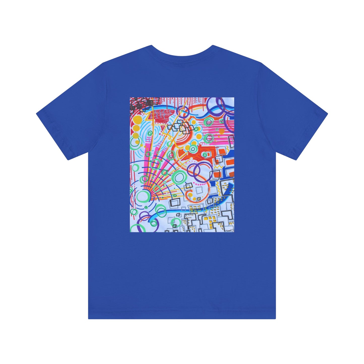 This is the True Royal The City Jersey T-Shirt by Storm Garden Studio. This showcases the back of the shirt. The image is from the upper back to the mid waist. The illustration is rectangular shaped and has a multitude of colors like blue, red, pink, yellow, green and light blue. It is an abstract image with building shapes, circles and squiggles. This is against a white background.