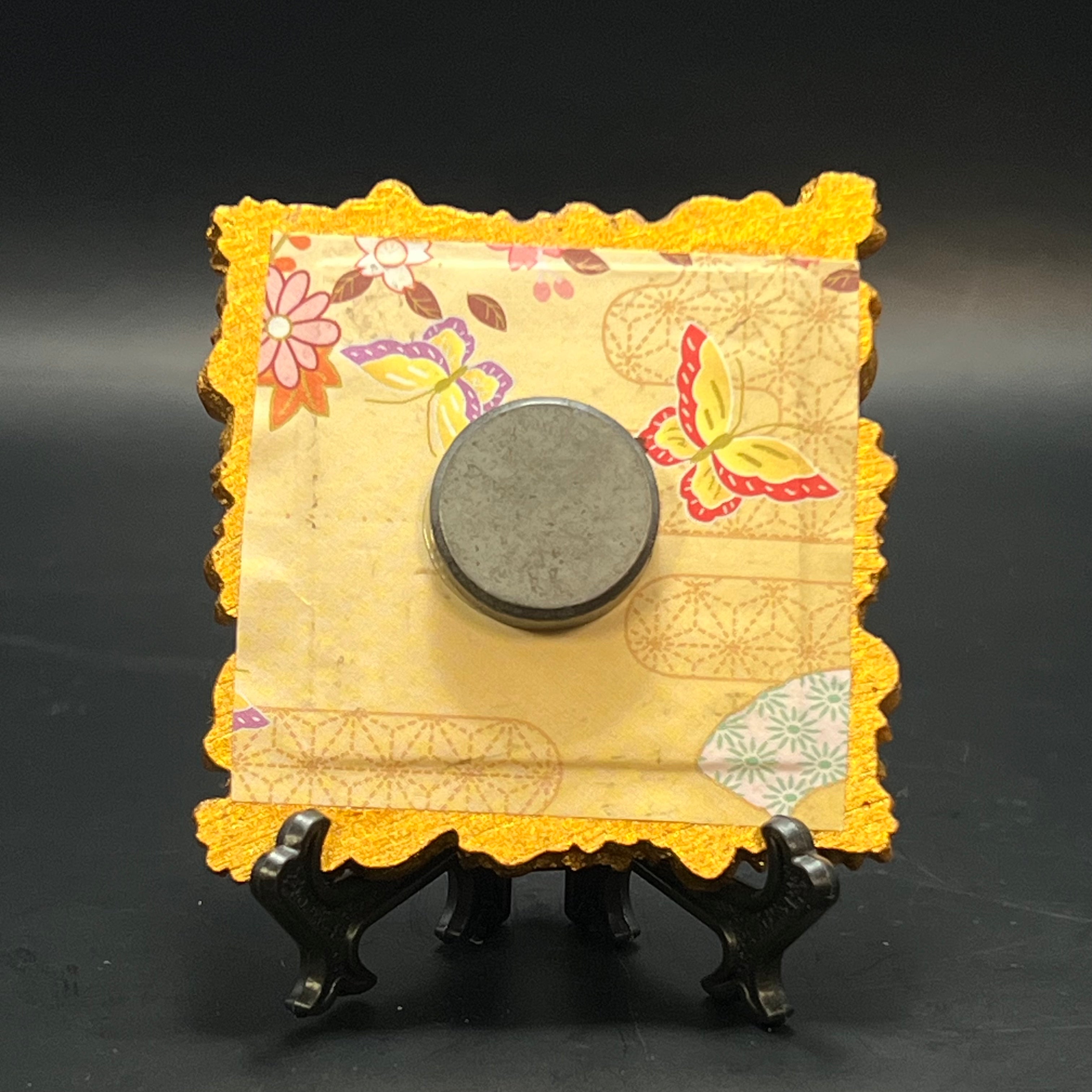 Close-up of the mini painting’s textured white lily petals and subtle brushstroke details on the canvas surface.