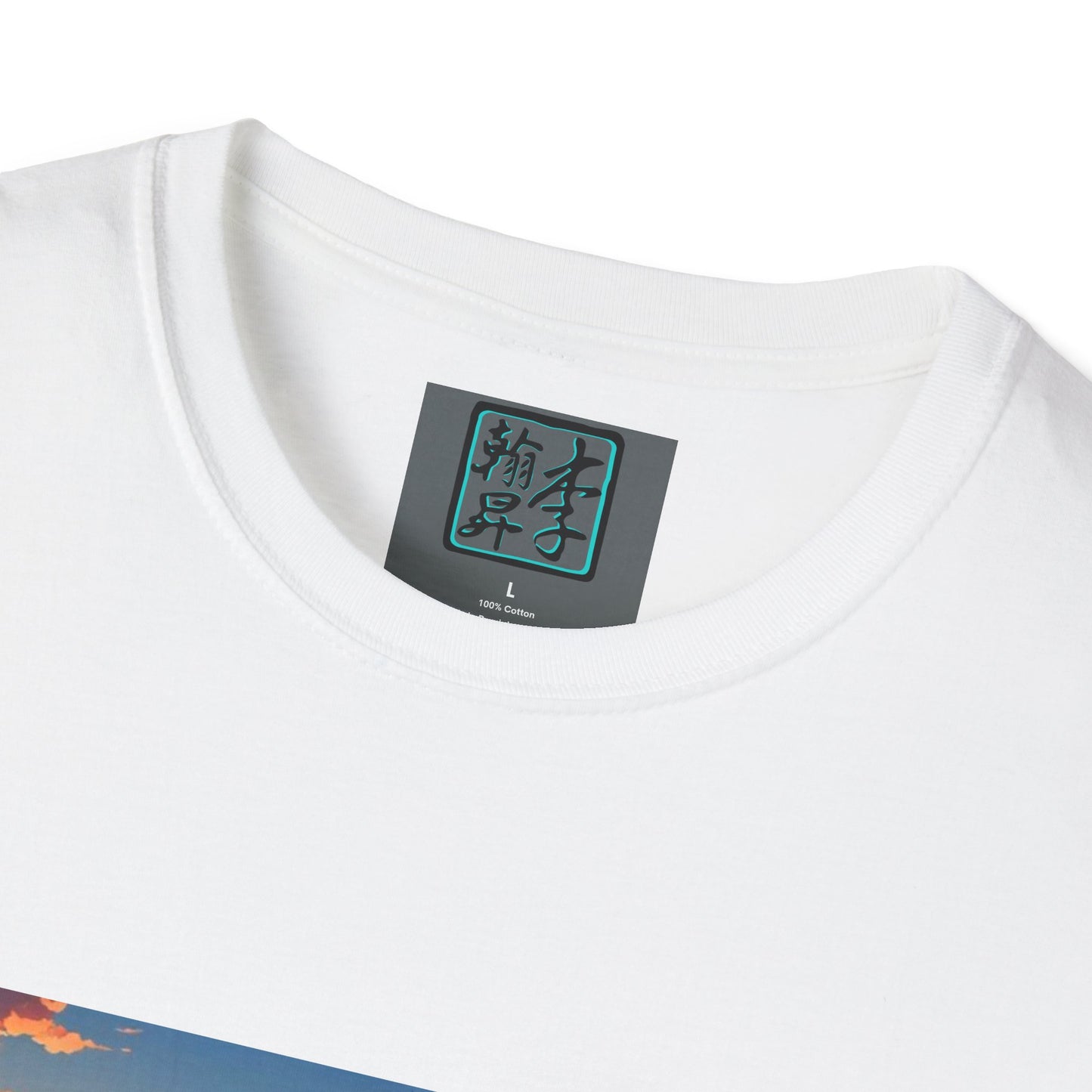 This is the White Temple of Peace Softstyle T-Shirt by Lee Hansheng Studios. It comes in sizes XS-5XL. This is an image of the t-shirt from the front but close up to the tag that is inside the shirt. There is the Lee Hansheng Studios logo printed in black and outlined in teal. The sizes are printed in white. This is all on a gray label. The shirt is against a white background.