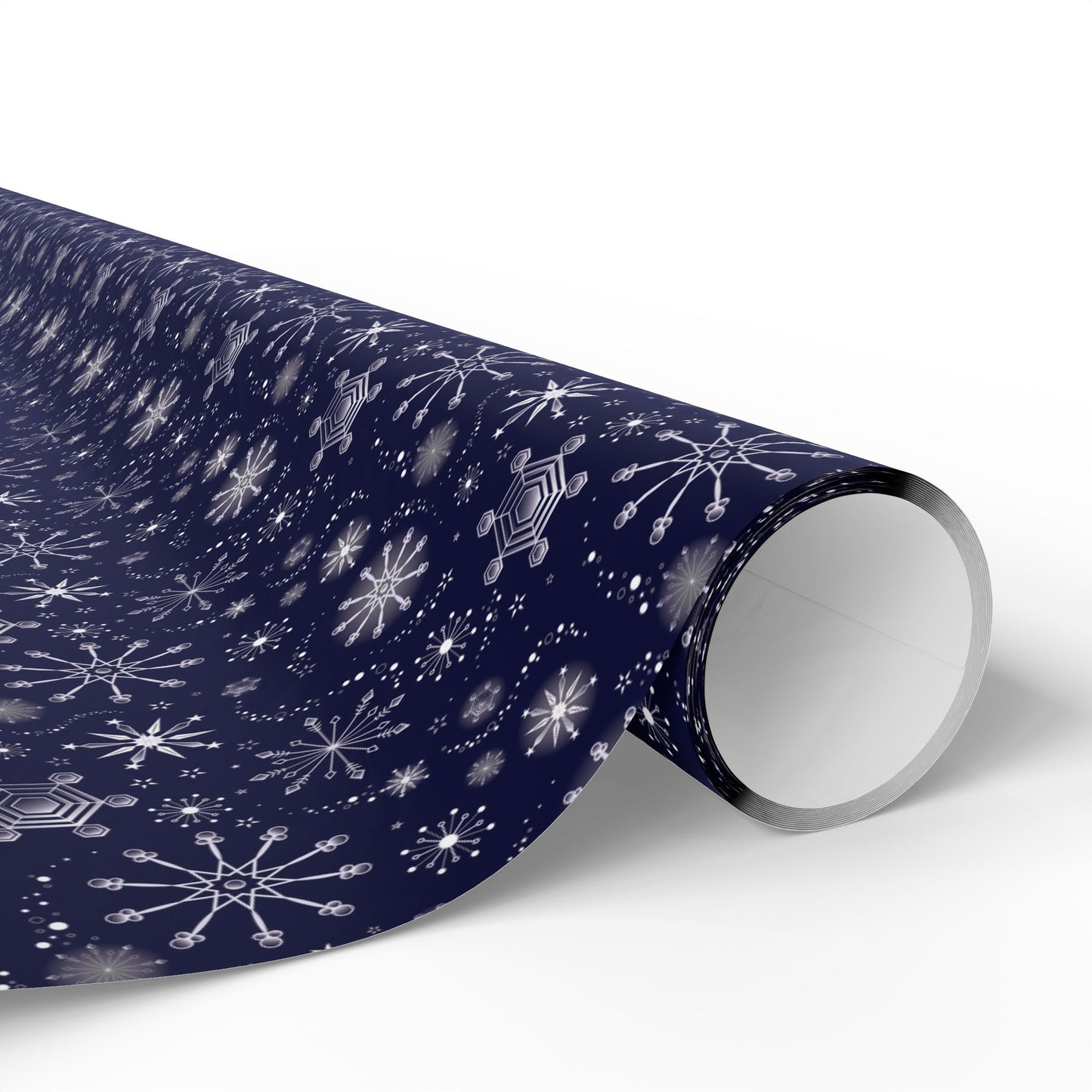 This is the glossy 30" x 180" Winter Blizzard Gift Wrap. The image is a roll of wrapping paper and the design at an angle. The background is white. The design are different types of snowflakes with different sizes of circles within each flake. The wrapping paper is dark blue and the snowflakes and design are all white.