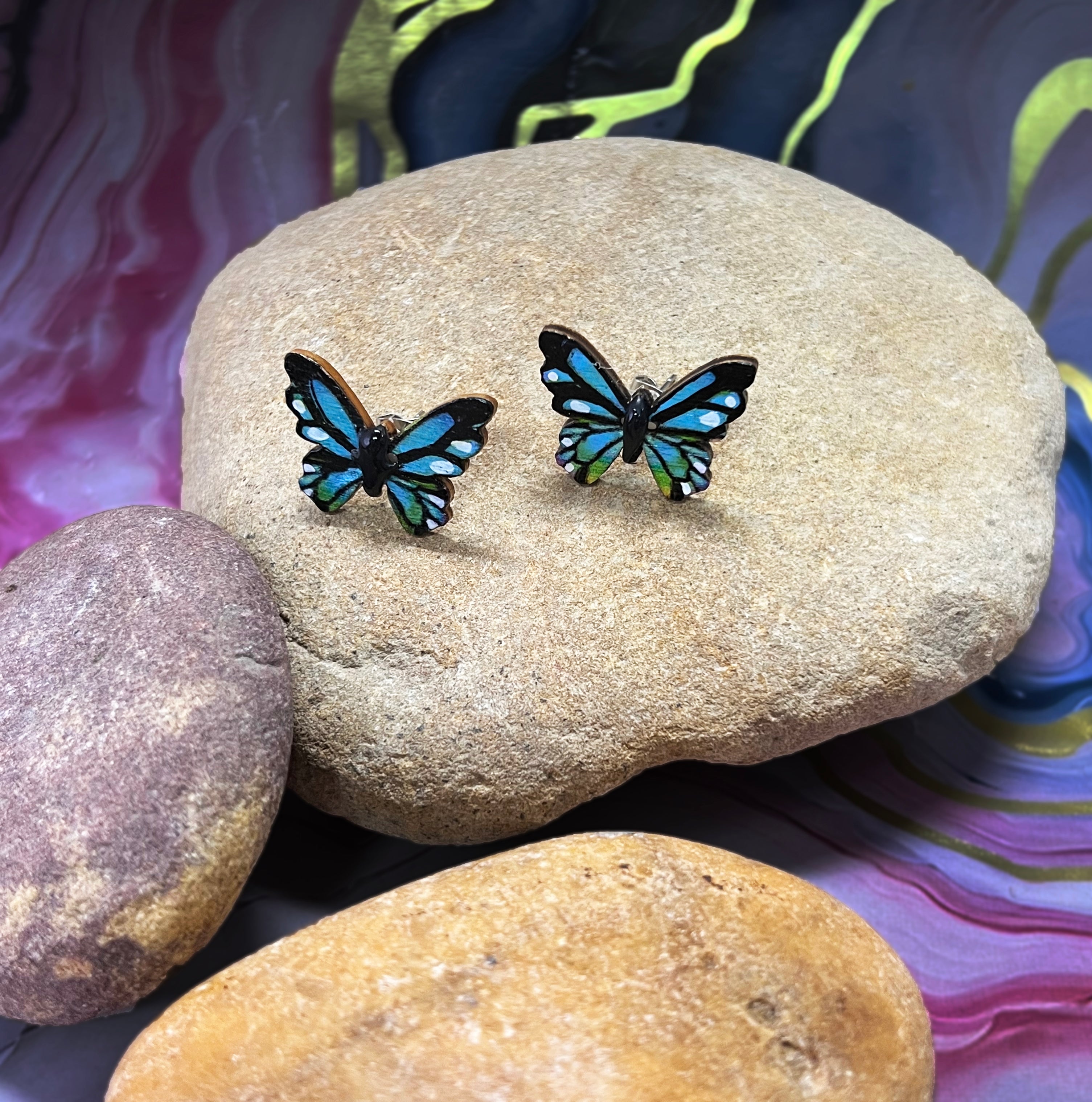 SGS Blue and Green Butterfly Earrings with sterling silver hooks, enamel-coated metal wings, and delicate leaf detailing by