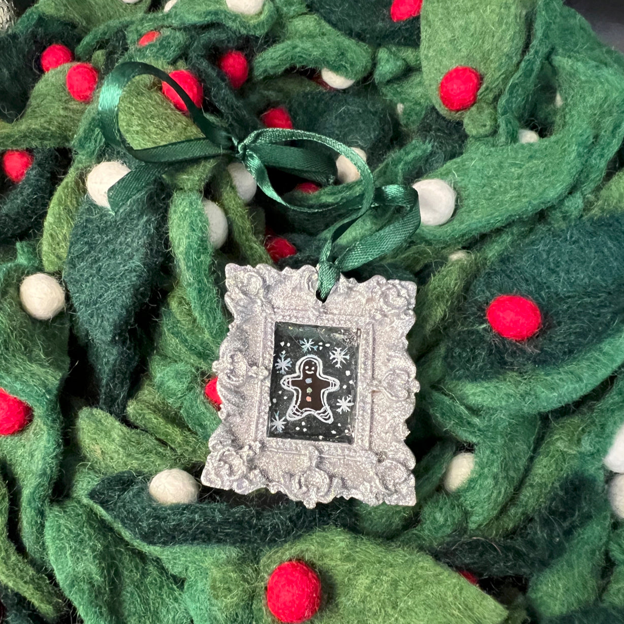 CFD Gingerbread Man Ornament with brown glazed ceramic surface, detailed icing accents, 4-inch height, branded by The Art