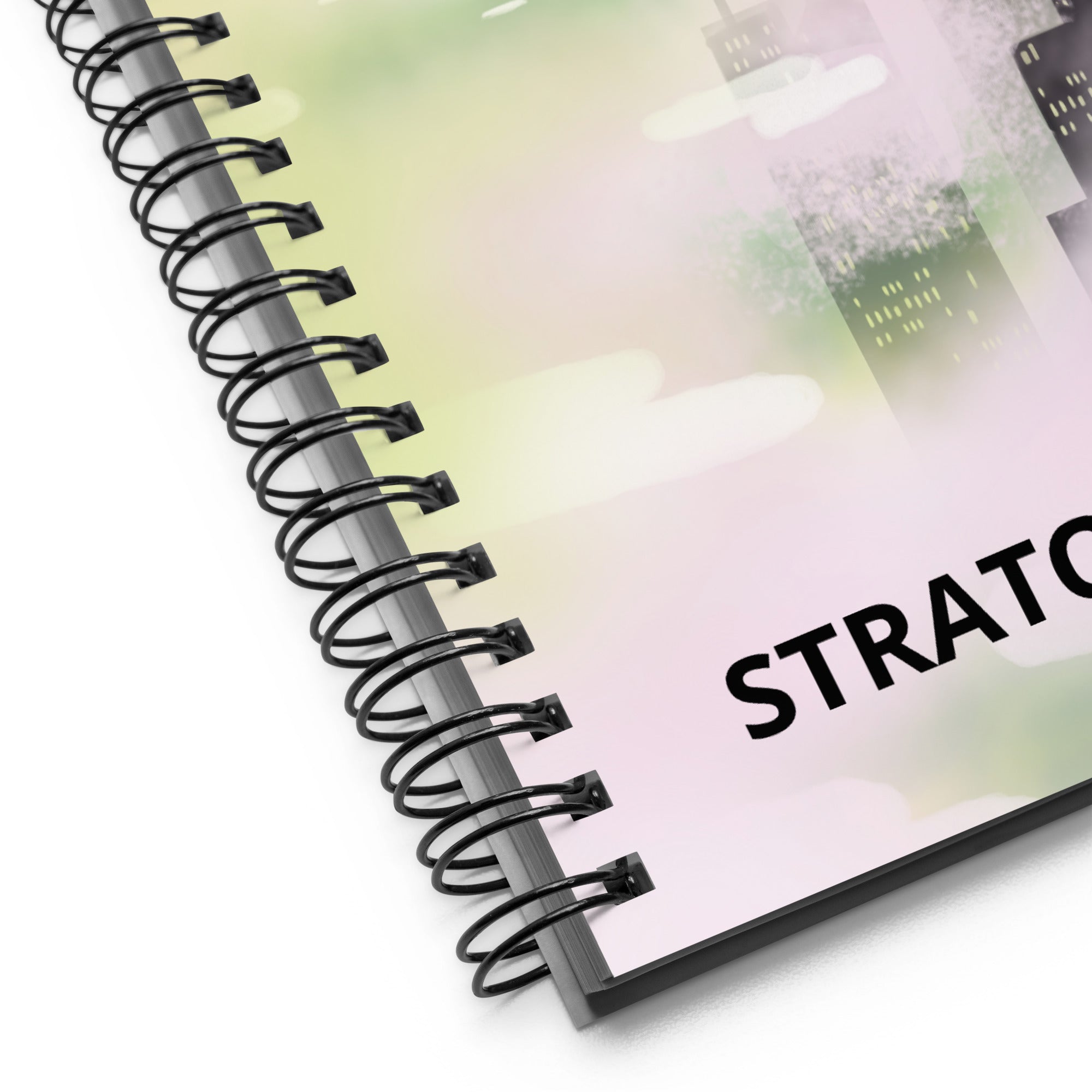 Close-up of spiral binding and textured notebook cover featuring vibrant blue and purple swirling patterns from an overhead