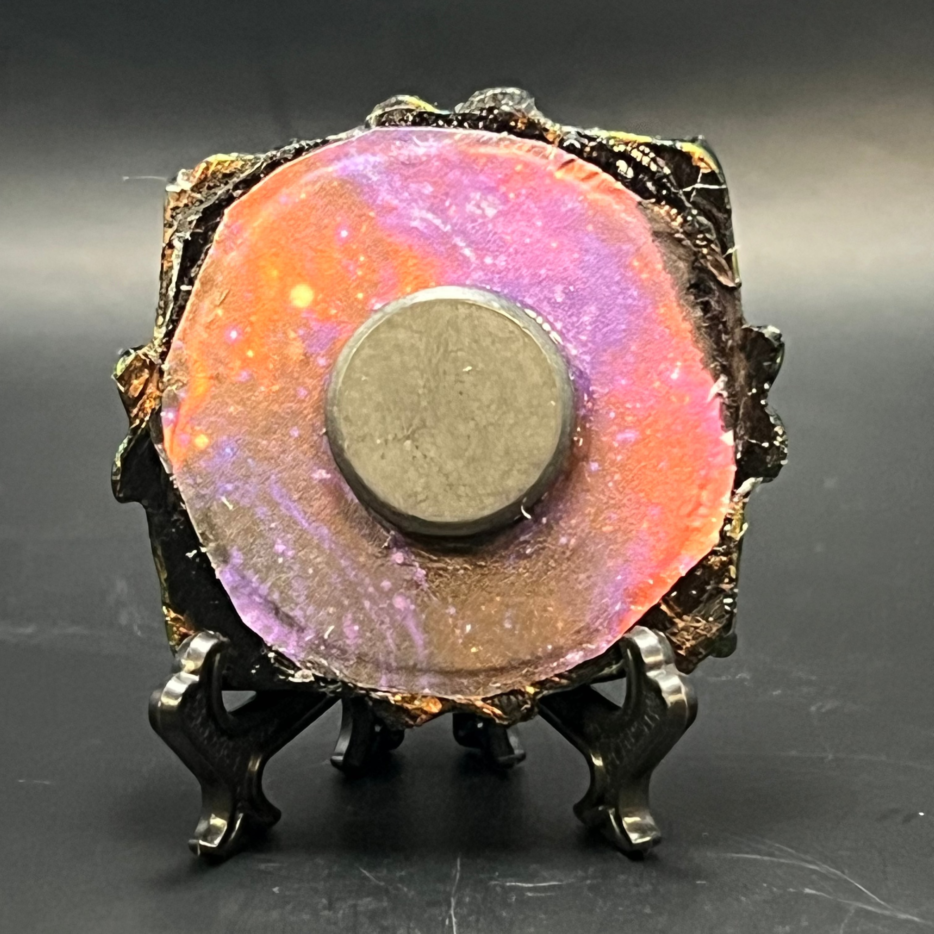 Close-up of textured brushstrokes highlighting vibrant color transitions and fine detail in the Ascension mini painting on