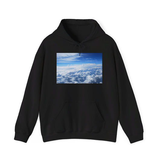 This is the Black Above the Clouds Hoodie by Lee Hansheng Studios. It comes in sizes S-5XL. This is the image of the front with a drawstring tied in a bow and color matched. The illustration on the front chest. The illustration shows an overview of the clouds from the sky. Through the foreground are white, light blue, dark blue fluffy clouds that straighten out in the background. There are clear blue skies in the background. There is a kangaroo pocket, hemming on the wrists and end of the hoodie.