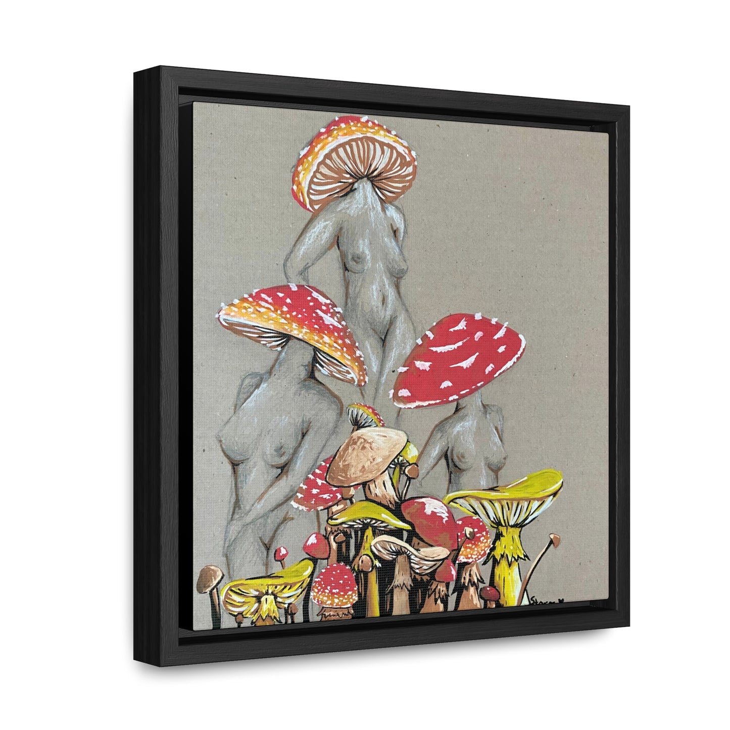 This is the 10" x 10" Miss Amanita Gallery Canvas Wrap with Black Square Frame by Storm Garden Studio. The depth of the frame is 1.25".The image shows the canvas tilted towards the left on a white wall. This is an illustration of three mushroom headed nude women. The foreground has assorted mushrooms in different sizes. The women are positioned in a triangle shape. The colors range from yellow,orange and red.Each of the bodies are shaded in white,black or grey and match the background of the illustration. 