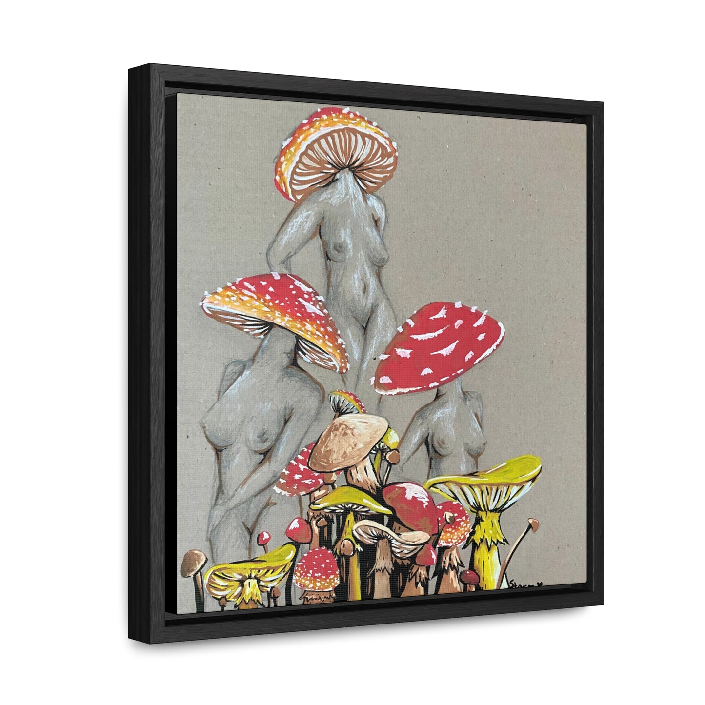 This is the 12" x 12" Miss Amanita Gallery Canvas Wrap with Black Square Frame by Storm Garden Studio. The depth of the frame is 1.25".The image shows the canvas tilted towards the left on a white wall. This is an illustration of three mushroom headed nude women. The foreground has assorted mushrooms in different sizes. The women are positioned in a triangle shape. The colors range from yellow,orange and red.Each of the bodies are shaded in white,black or grey and match the background of the illustration. 