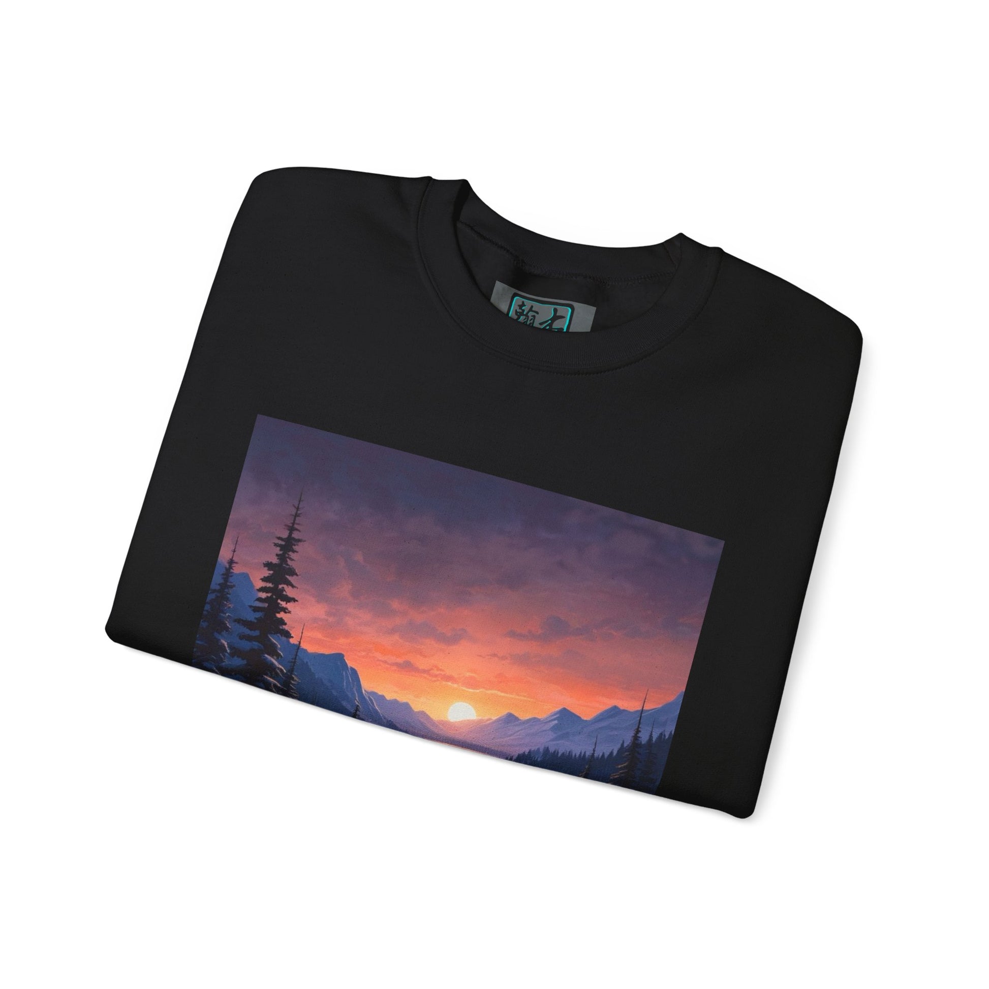 This is the Black Snow Valley Sweatshirt that is a crewneck coming in S - 5XL sizes. The crewneck is folded and against a white background. This design is by Lee Hansheng Studios and showcases the sun rising past the horizon and consist of yellow, orange, red hues which is illuminated onto the tips of the dark green pine trees and the wispy clouds. Further in the background the mountain tops line the horizon. The size label is printed on the inside with the studio logo outlined in blue and black.