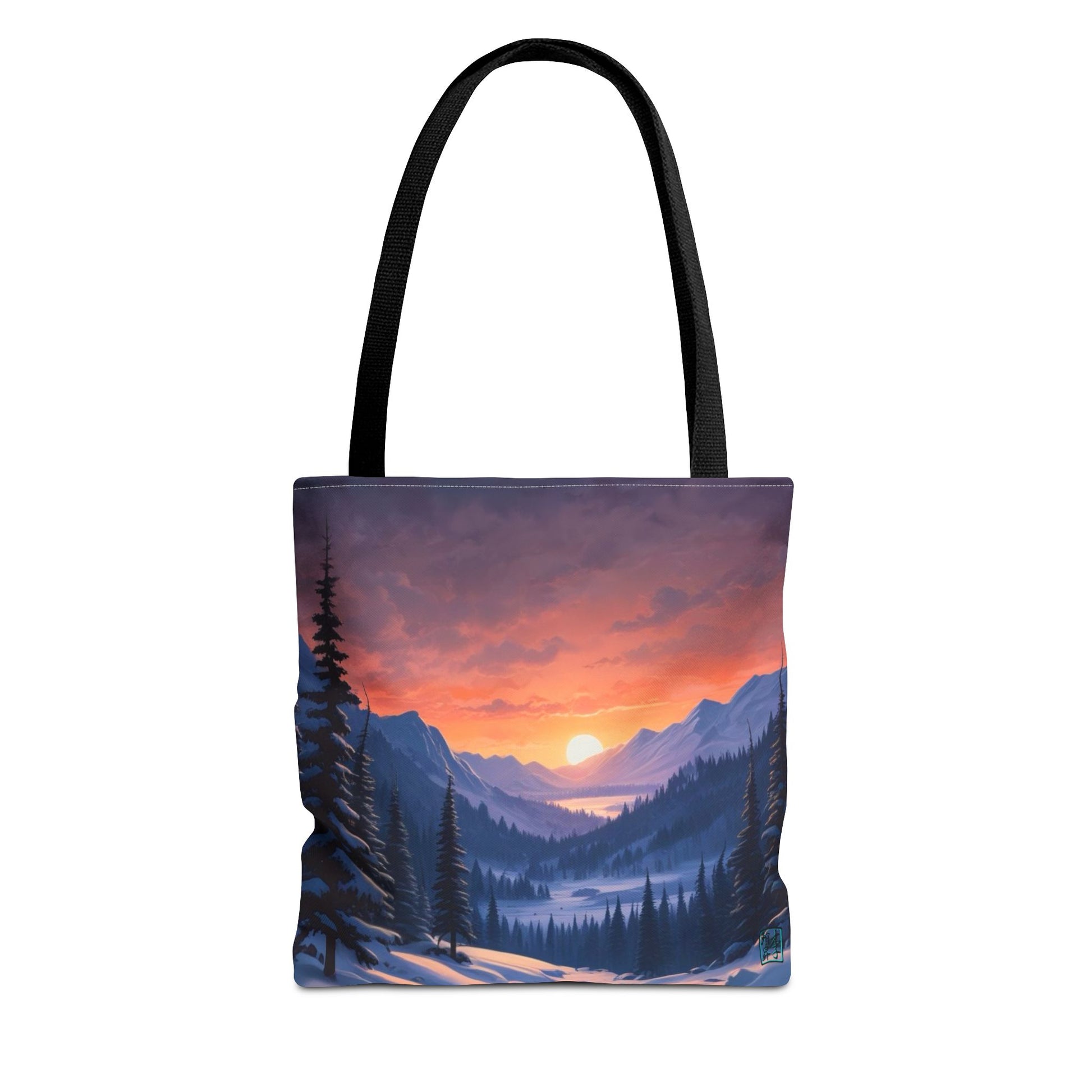 The Black 13" x 13" Snow Valley Tote Bag has color matched handles and all around print. The tote is against a white background.The design by Lee Hansheng Studios showcases a snowy hill/mountain area with large pine trees on both sides continuing into the horizon. The sun rises past the horizon consisting of yellow,orange,red hues illuminating onto wispy clouds,snowy field, mountains and dark green pine trees. 