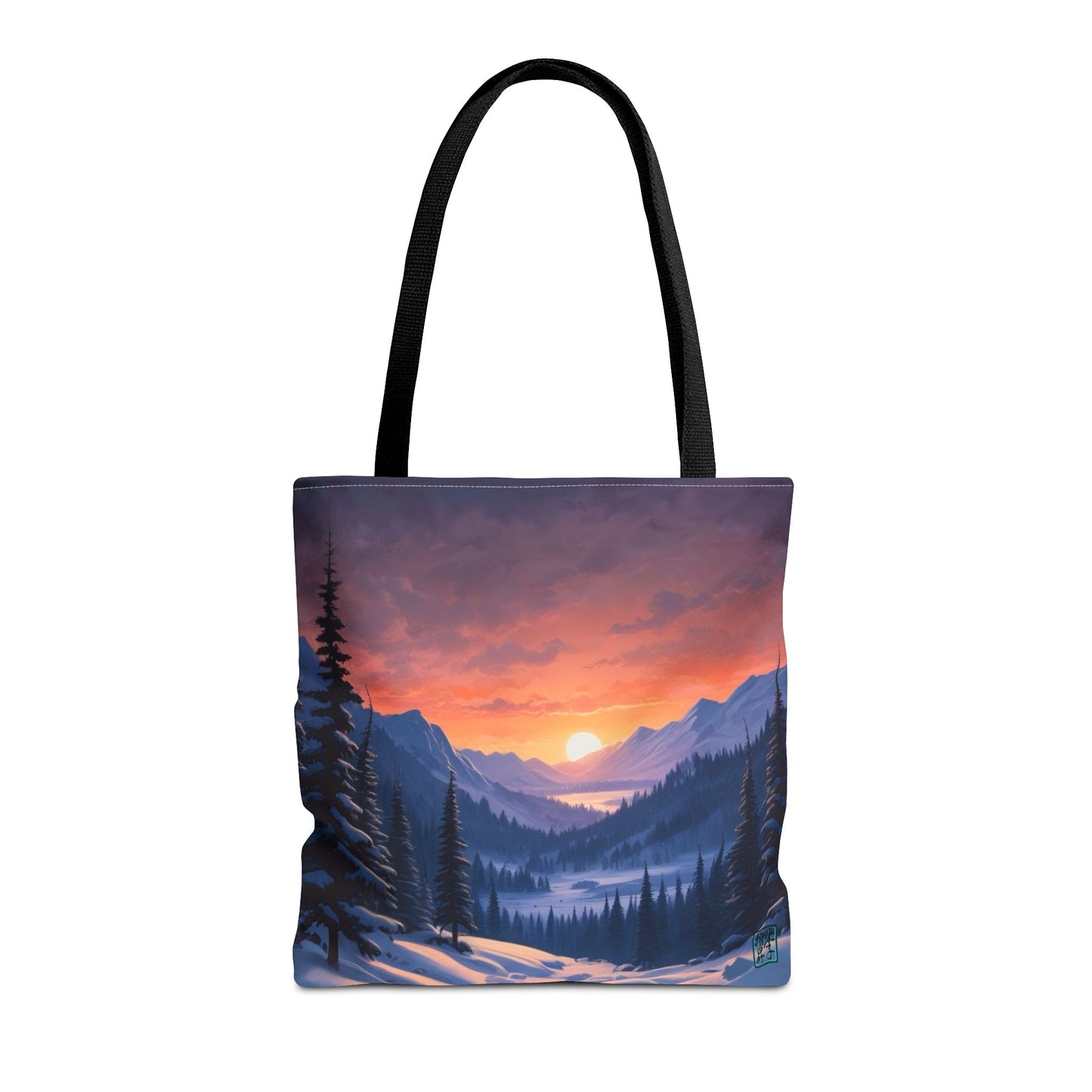 The Black 16" x 16" Snow Valley Tote Bag has color matched handles and all around print. The tote is against a white background.The design by Lee Hansheng Studios showcases a snowy hill/mountain area with large pine trees on both sides continuing into the horizon. The sun rises past the horizon consisting of yellow,orange,red hues illuminating onto wispy clouds,snowy field, mountains and dark green pine trees. 