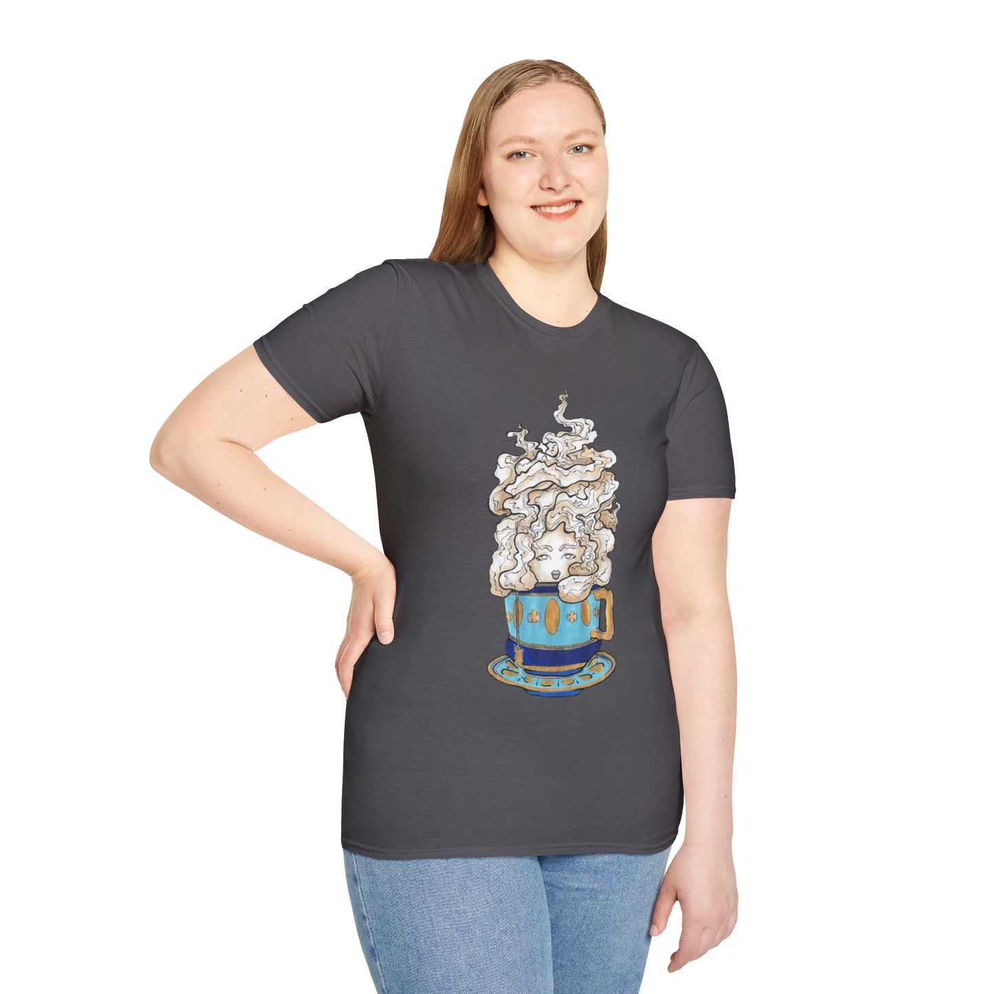 This is the Charcoal Earl Grey Softstyle T-Shirt by Chris Foster Design. It comes in sizes XS-5XL. The illustration is of a gold, light blue and dark blue teacup with a tan, yellow and white steam. The steam is swirly and goes up and outwards. In the middle is a lady's face. A smiling lady facing the front with her head tilted slightly to the left, hair behind shoulders, right hand on waist, other hand hanging naturally and is wearing dark jeans and the designed t-shirt. 