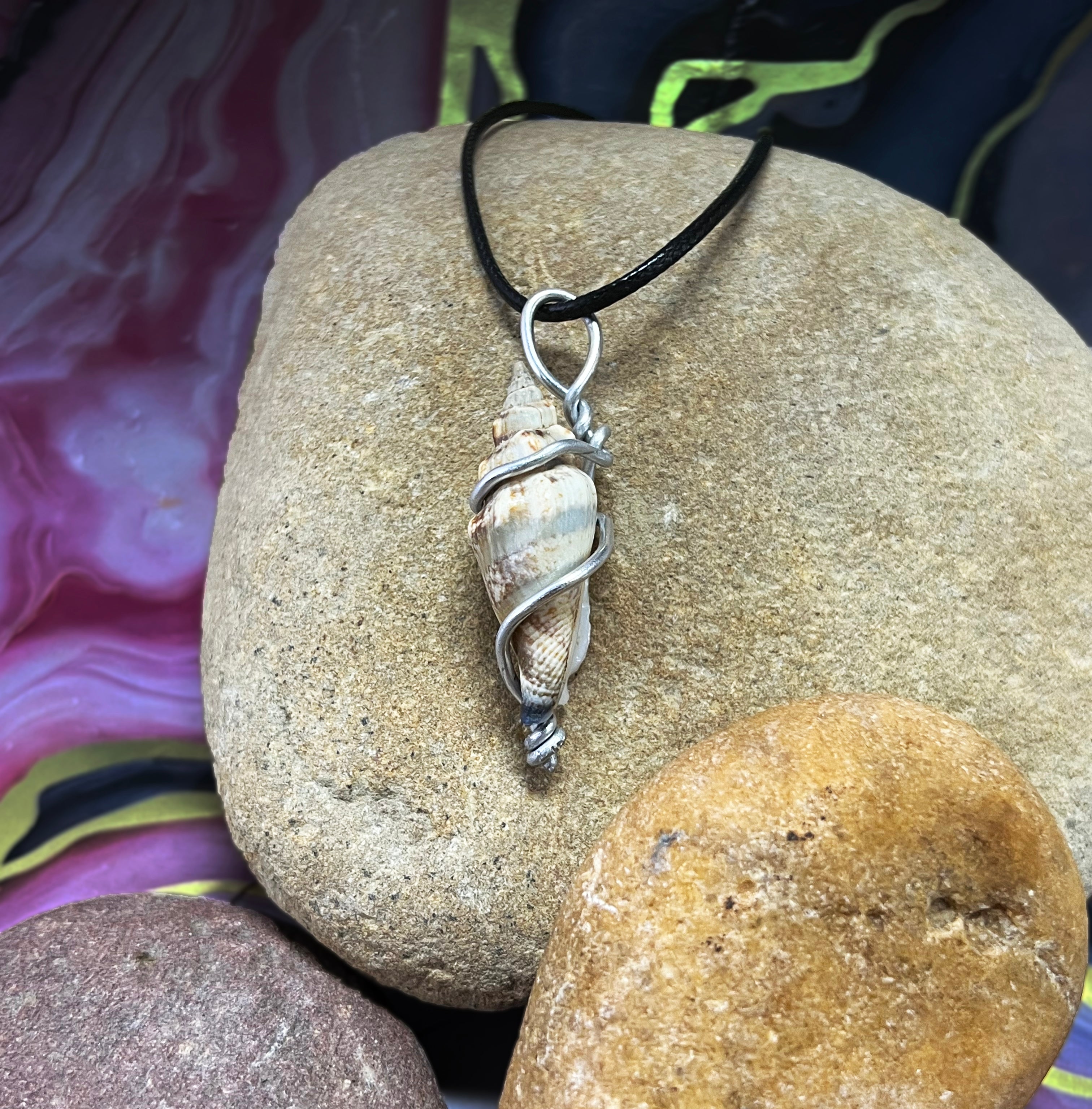 SGS Conidae wire wrap necklace with vertical brown line pattern, sterling silver chain, lobster clasp, and oxidized finish