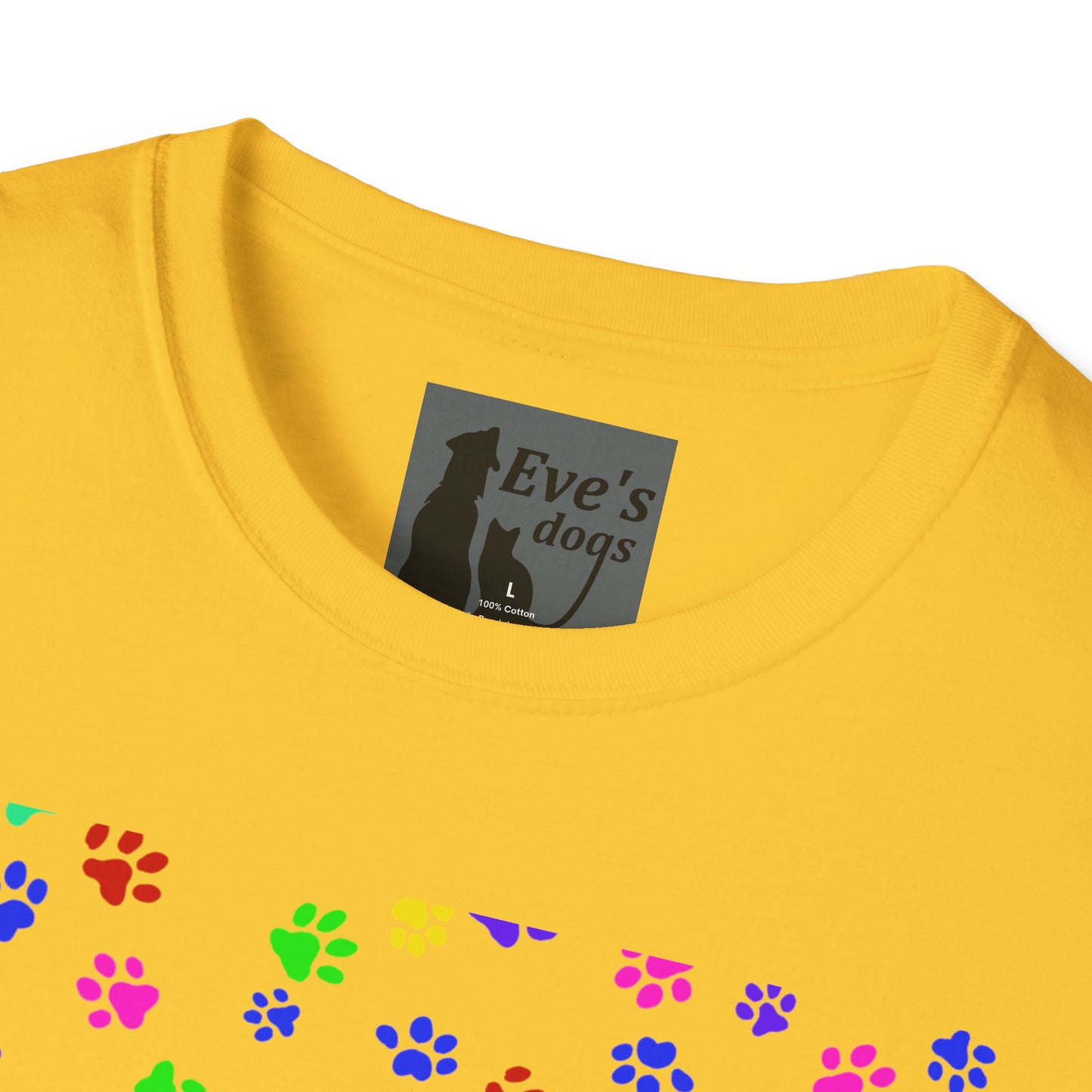 This is the Daisy Adopt Eve's Dogs T-Shirt. It comes in XS - 5XL. This is an upclose image of the shirt where the neck/tag is. The size label is a grey and black tag with a dog and cat with the "Eve's dogs" writing. The sizes and shirt product materials are printed in white. There is a little bit of paw prints on the front.  The colors are pink, green, blue, purple, red paw prints in different sizes. It is against a white background.
