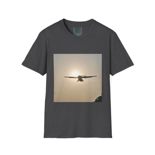 This is the Dark Heather Landing T-Shirt by Lee Hansheng Studios. This is an image of the front folded. On the inside of the shirt is the logo for the studio printed in black outlined in blue, gray size label with the print being white. The illustration is a rectangular design of an airplane landing. There is an orange/yellow sun with the shadowed plane. Some trees on the right end corner. The shirt is against a white background.