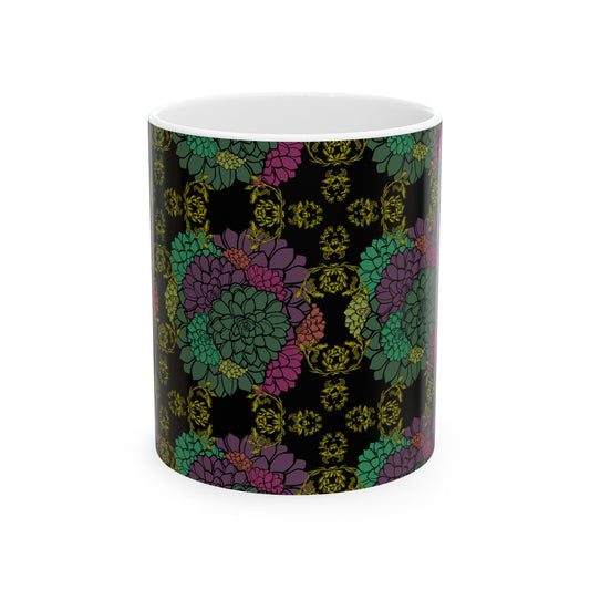 This is the 11oz Echeveria In Bloom Ceramic Mug in white designed by Chris Foster Design displaying from the front. The handle for the mug is on the back. The all over print has a background of black with the flowers in pink, purple, orange, green and dark green colors. There is a gold/dark yellow intricate design in bloom through out the mug.