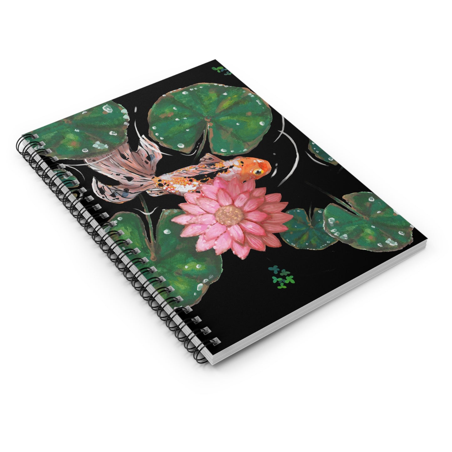 This is the Goldfish Spiral Ruled Notebook by Chris Foster Design. This shows the front of the notebook that is slanted, closed with the illustration on the front and the black spiral bind. The illustration is squared, the background is black, nine dark or light green lily pads, small foliage, one orange, white and black goldfish and a pink blooming flower.