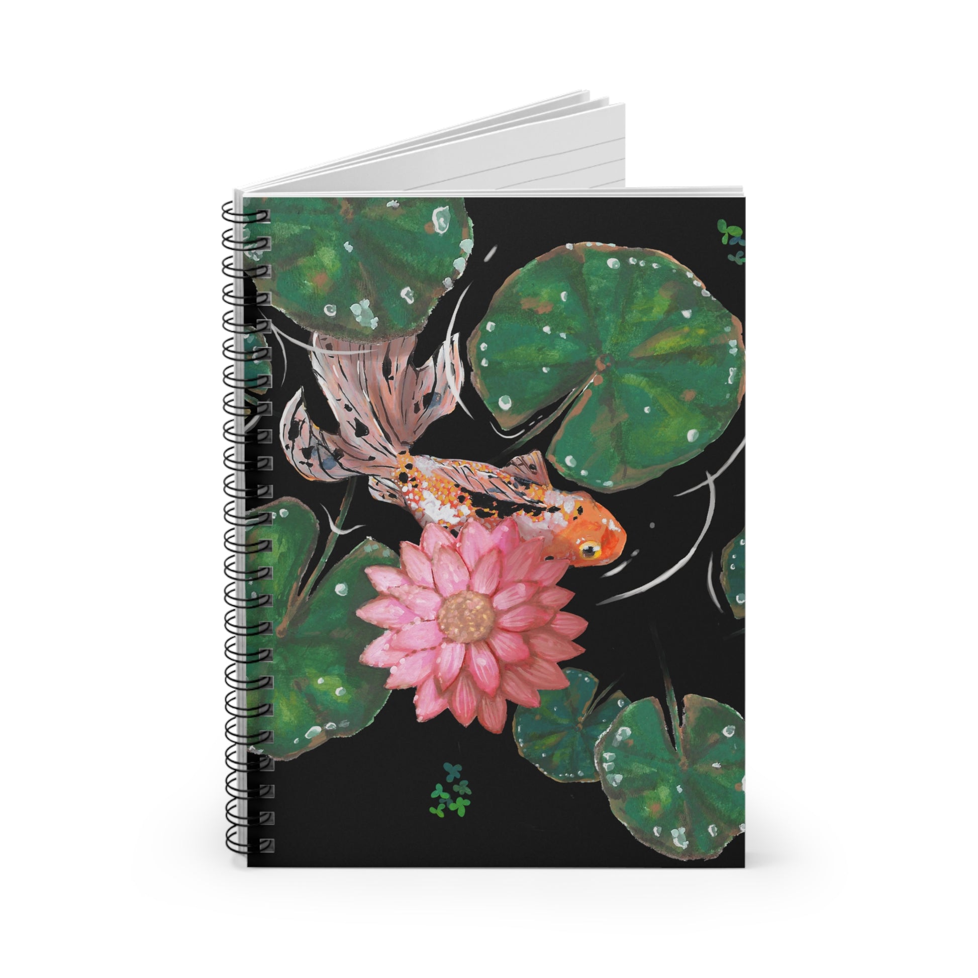 This is the Goldfish Spiral Ruled Notebook by Chris Foster Design. This shows the front of the notebook upright, slightly opened to see the black lined paper, with the illustration and the black spiral bind. The illustration is squared, the background is black, nine dark or light green lily pads, small foliage, one orange, white and black goldfish and a pink blooming flower.