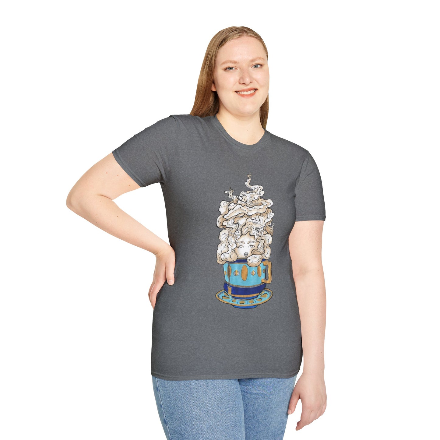 This is the Graphite Heather Grey Earl Grey Softstyle T-Shirt by Chris Foster Design. It comes in sizes XS-5XL. The illustration is of a gold, light blue and dark blue teacup with a tan, yellow and white steam. The steam is swirly and goes up and outwards. In the middle is a lady's face. A smiling lady facing the front with her head tilted slightly to the left, hair behind shoulders, right hand on waist, other hand hanging naturally and is wearing dark jeans and the designed t-shirt. 