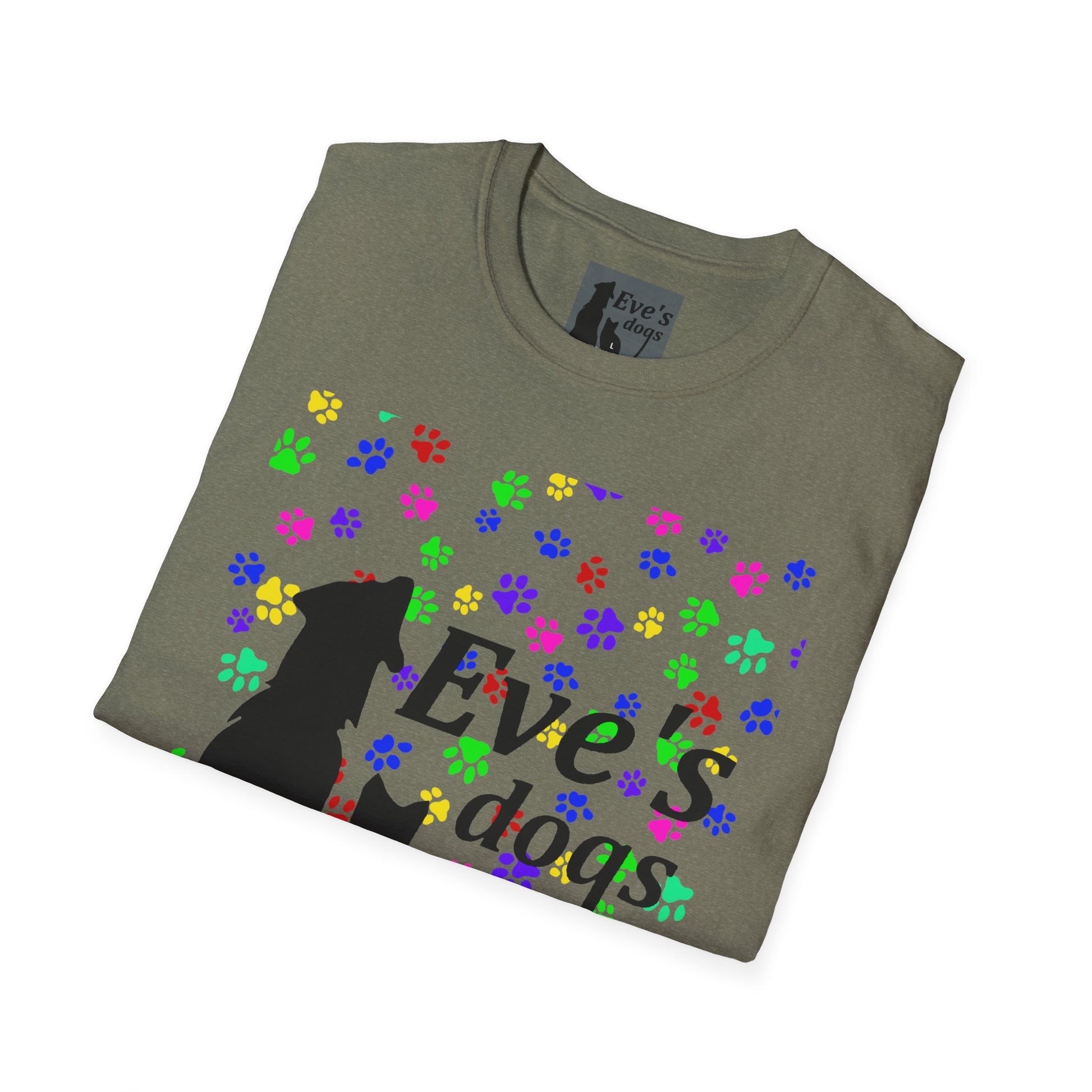 This is the Heather Military Green Adopt Eve's Dogs T-Shirt. It comes in XS - 5XL. The image is the shirt folded and showing the front. The size label is a grey and black tag with a dog and cat with the "Eve's dogs" writing. The front has pink, green, blue, purple, red paw prints in different sizes. Also, the dog and cat with "Eve's dogs" printed in black. It is against a white background.