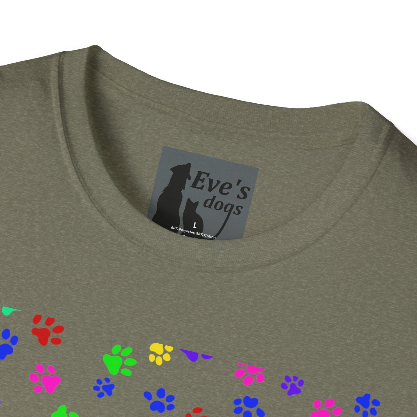 This is the Heather Military Green Adopt Eve's Dogs T-Shirt. It comes in XS - 5XL. This is an upclose image of the shirt where the neck/tag is. The size label is a grey and black tag with a dog and cat with the "Eve's dogs" writing. The sizes and shirt product materials are printed in white. There is a little bit of paw prints on the front.  The colors are pink, green, blue, purple, red paw prints in different sizes. It is against a white background.