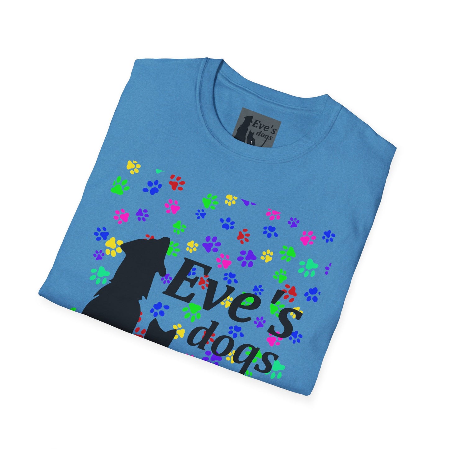 This is the Heather Sapphire Adopt Eve's Dogs T-Shirt. It comes in XS - 5XL. The image is the shirt folded and showing the front. The size label is a grey and black tag with a dog and cat with the "Eve's dogs" writing. The front has pink, green, blue, purple, red paw prints in different sizes. Also, the dog and cat with "Eve's dogs" printed in black. It is against a white background.