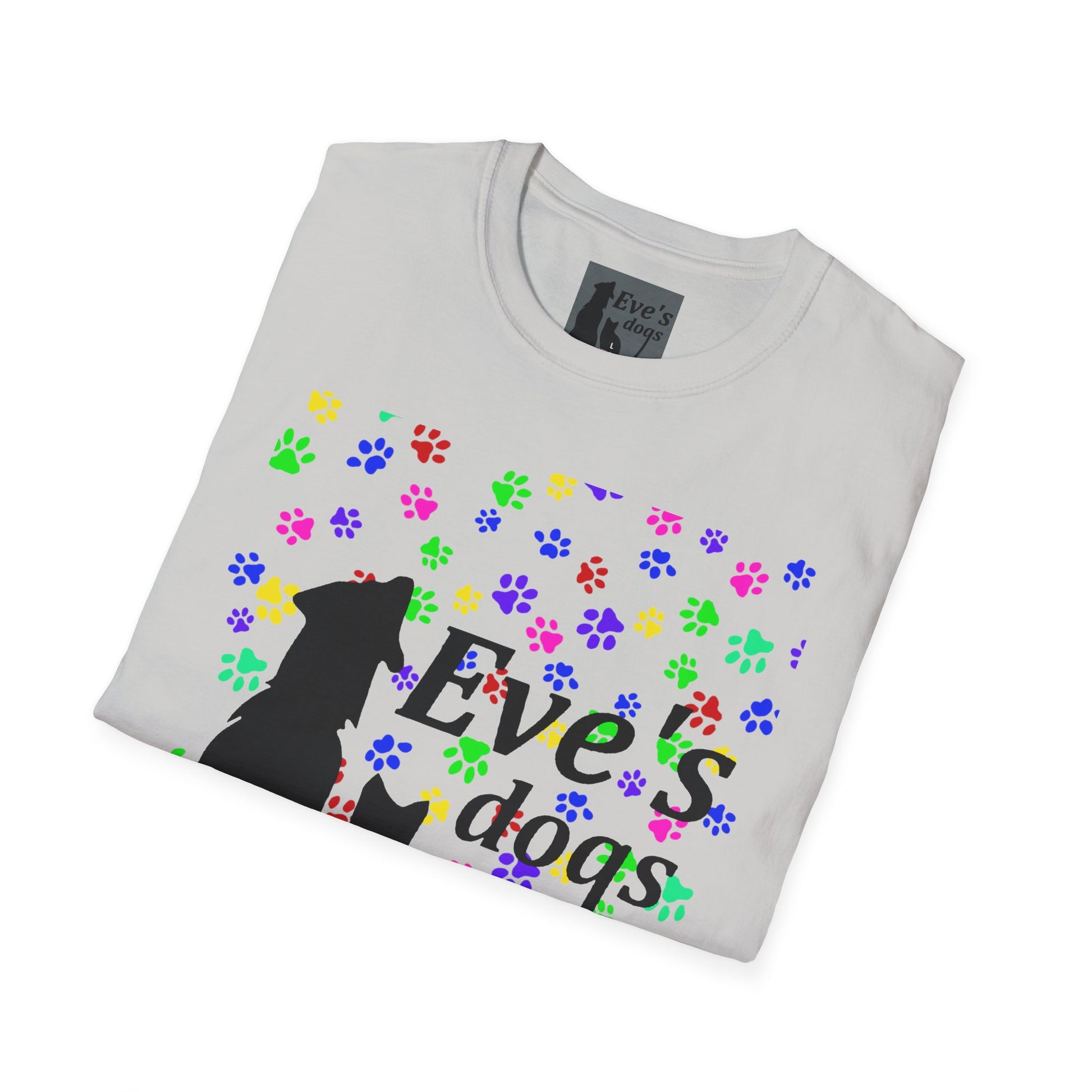 This is the Ice Grey Adopt Eve's Dogs T-Shirt. It comes in XS - 5XL. The image is the shirt folded and showing the front. The size label is a grey and black tag with a dog and cat with the "Eve's dogs" writing. The front has pink, green, blue, purple, red paw prints in different sizes. Also, the dog and cat with "Eve's dogs" printed in black. It is against a white background.