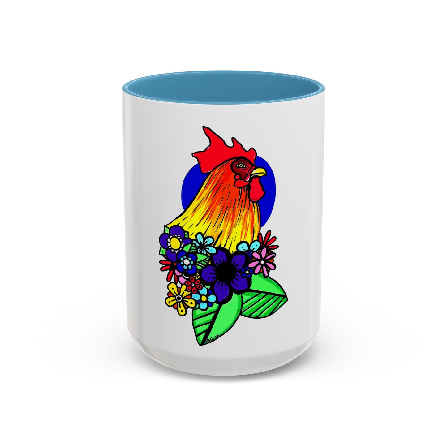 This it the Light Blue 15 oz Cock Accent Coffee Mug by Storm Garden Studio. This image showcases the front of the mug. The illustration is of a rooster with a dark blue circular background. The rooster is adorned with flowers on the bottom of its neck. It is bright green, dark blue, yellow, orange and pink. The rooster is bright red and fades into yellow. The mug is against a white background. 
