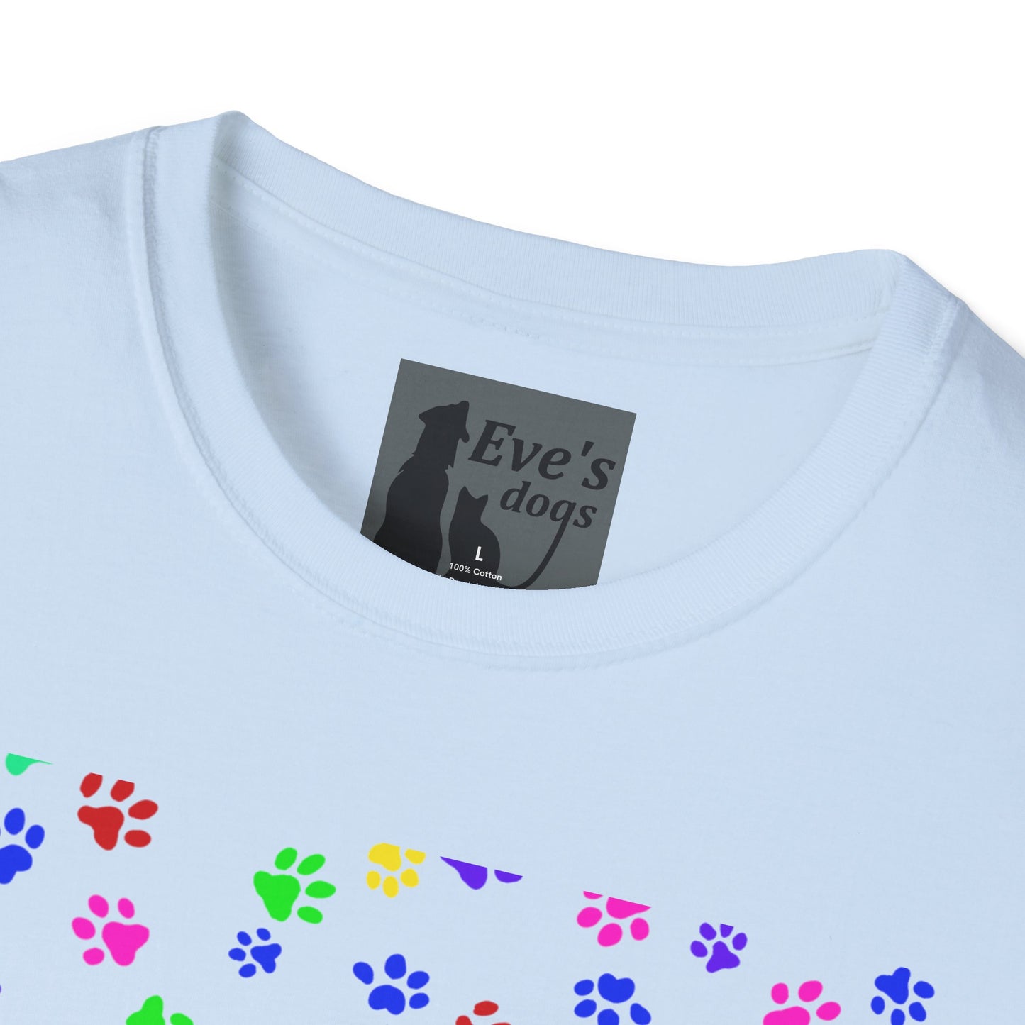 This is the Light Blue Adopt Eve's Dogs T-Shirt. It comes in XS - 5XL. This is an upclose image of the shirt where the neck/tag is. The size label is a grey and black tag with a dog and cat with the "Eve's dogs" writing. The sizes and shirt product materials are printed in white. There is a little bit of paw prints on the front.  The colors are pink, green, blue, purple, red paw prints in different sizes. It is against a white background.
