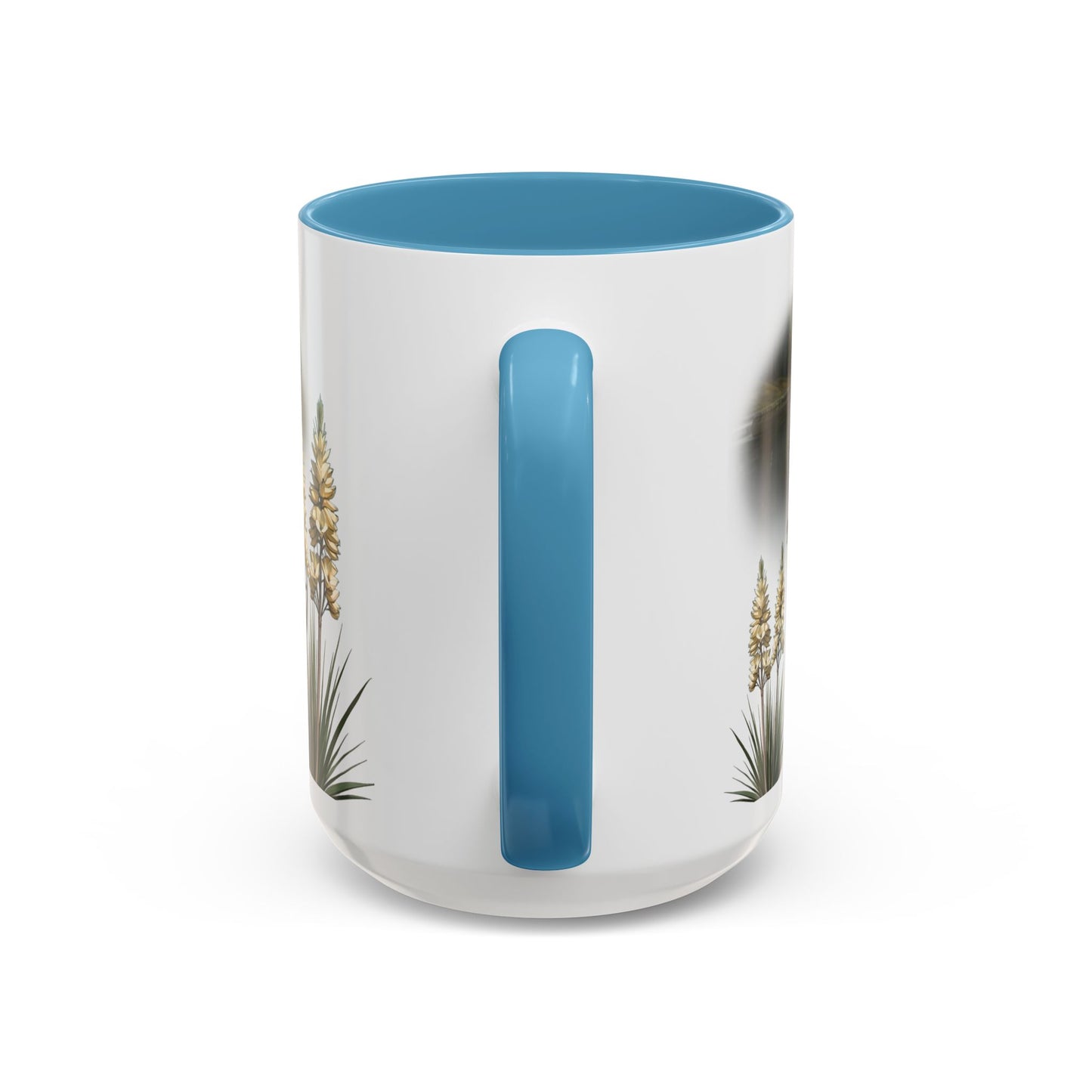 This is the 15oz Light Blue Lake Gaston Mug. It is an illustration by Lee Hansheng Studios. The picture is shown from the handle. The handle and inside of mug is color matched too. There are some American yucca plants shown on the left and right side. The mug is all white except for the illustration and handle.