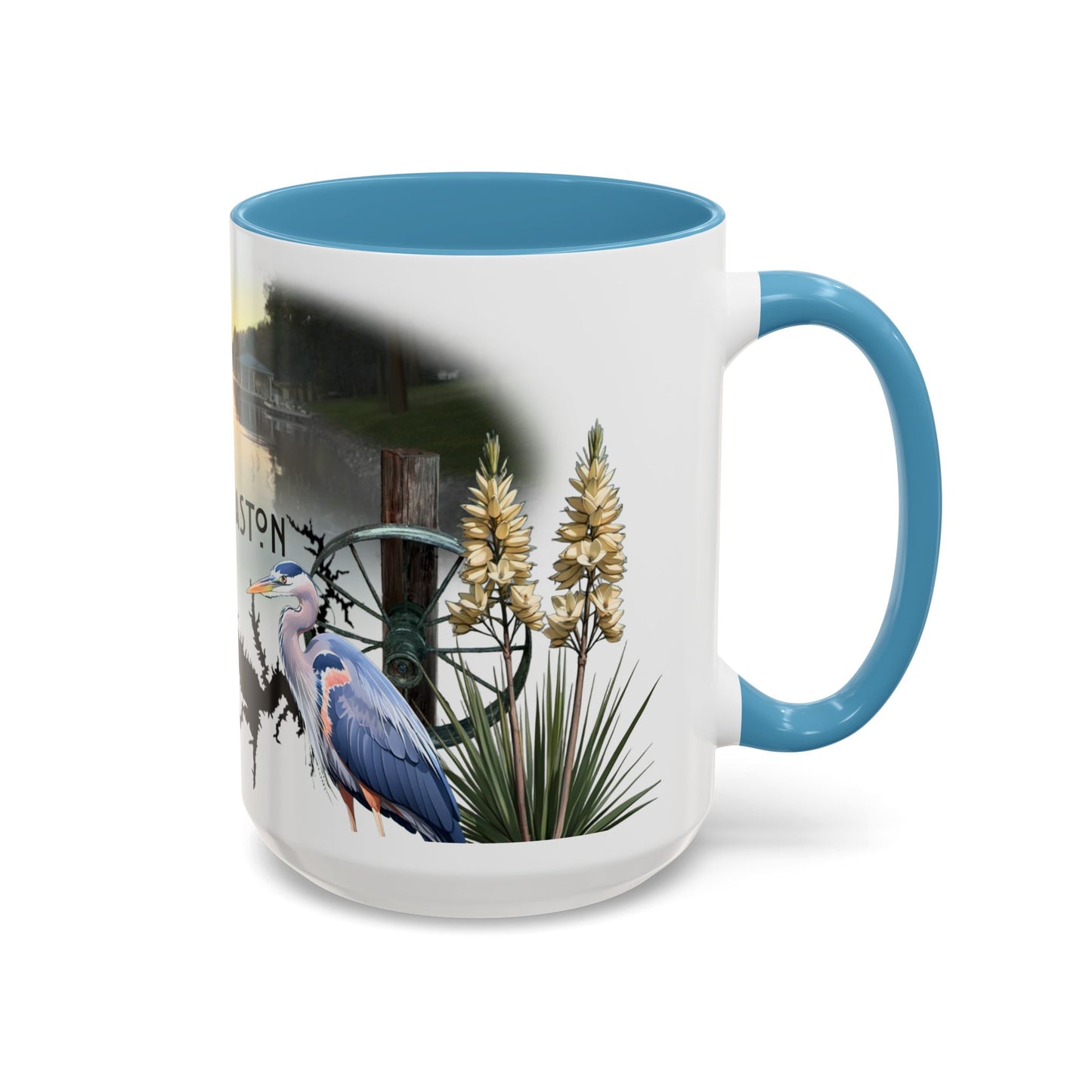 This is the 15oz Light Blue Lake Gaston Mug. It is an illustration by Lee Hansheng Studios. The picture is shown from the right side of the mug. The handle and inside of mug are color matched too. The mug is all white except for the illustration and handle. The illustration shows two yucca plants on the right, a great blue heron and a green wheel that is attached to a log. The mug is against a white background in the picture too.