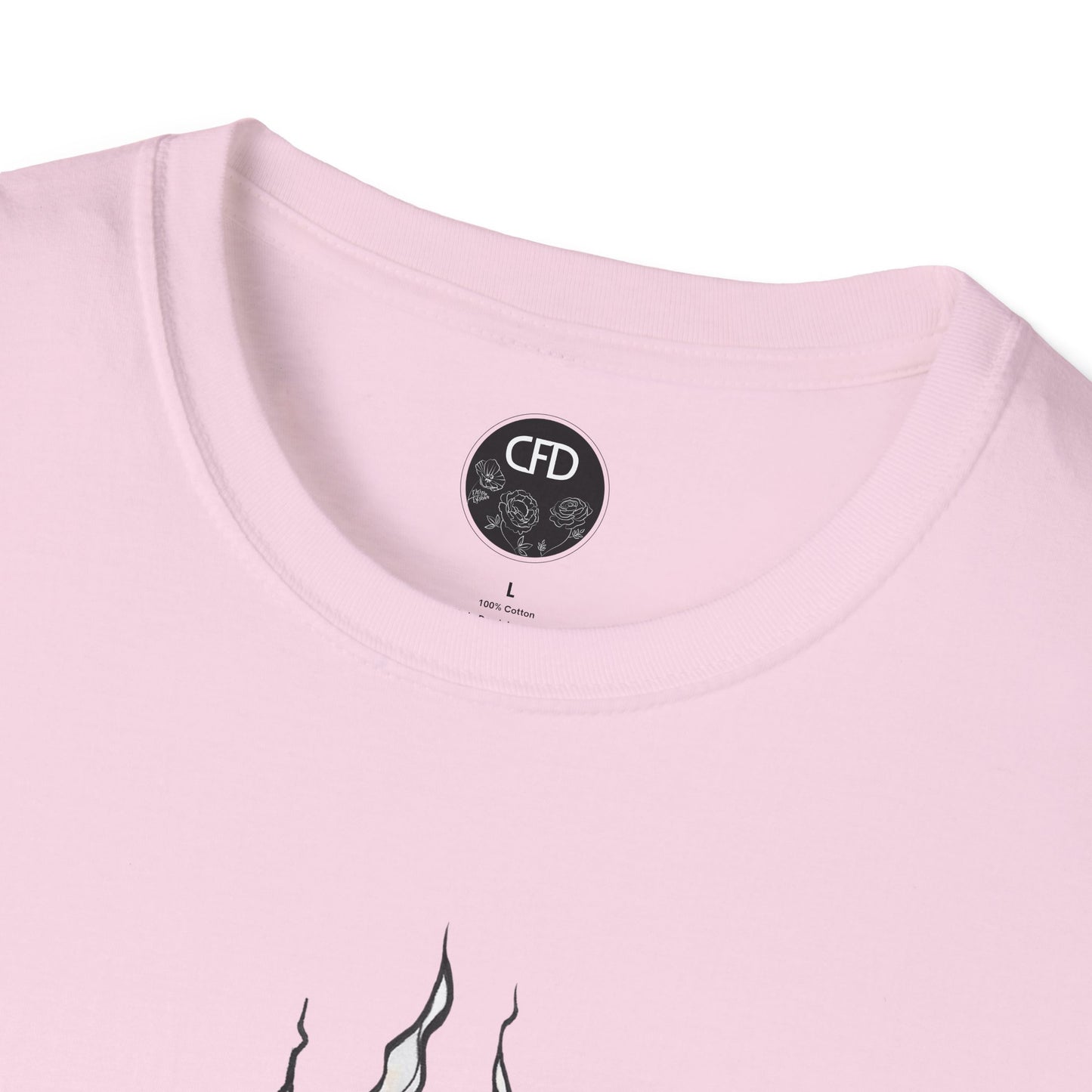 This is the Light Pink English Breakfast Tea T-Shirt by Chris Foster Design. It comes in sizes XS-5XL. This is a close up of the front with a circular CFD logo in white lettering and black background. The CFD logo and white flowers surrounding the bottom of the lettering. The size label is below the logo in black. From the closeup a little bit of the illustration is white wisps. The image is against a white background.